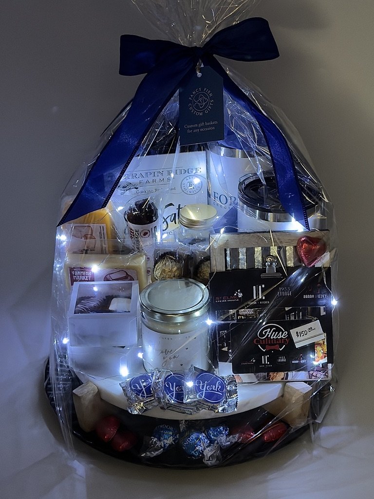 I had fun adding pizzazz to the primary give away at a fund raiser with the theme of "Date Night." This actually includes 'two' dates... an "evening in" with everything needed for charcuterie snacking at home on a naturall, solid marble base, a varie