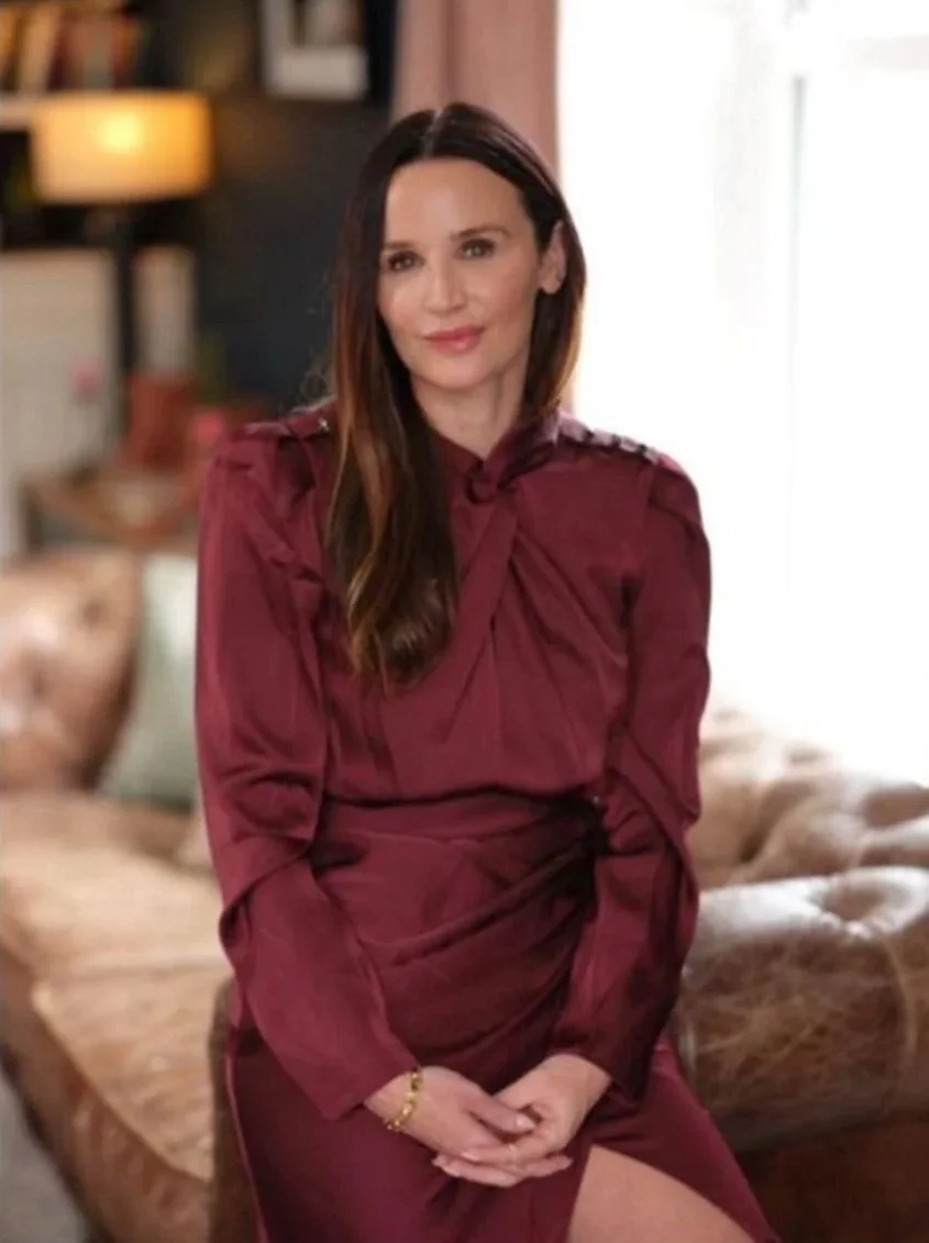 Jodie Slee, EMDR therapist, wearing a burgundy dress in a calm therapy room setting