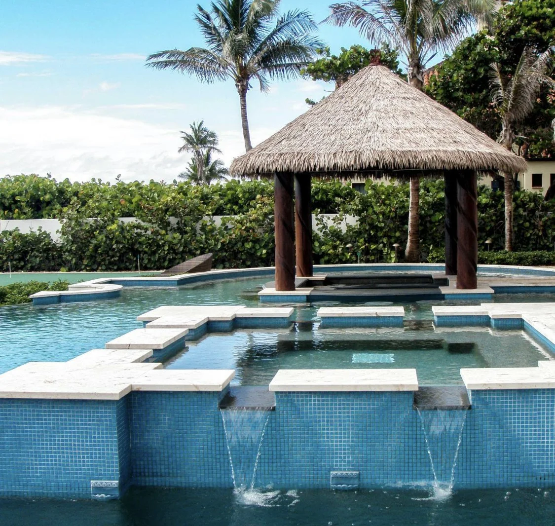 mamalapan, pool bar, carved logs synthetic thatch.jpg