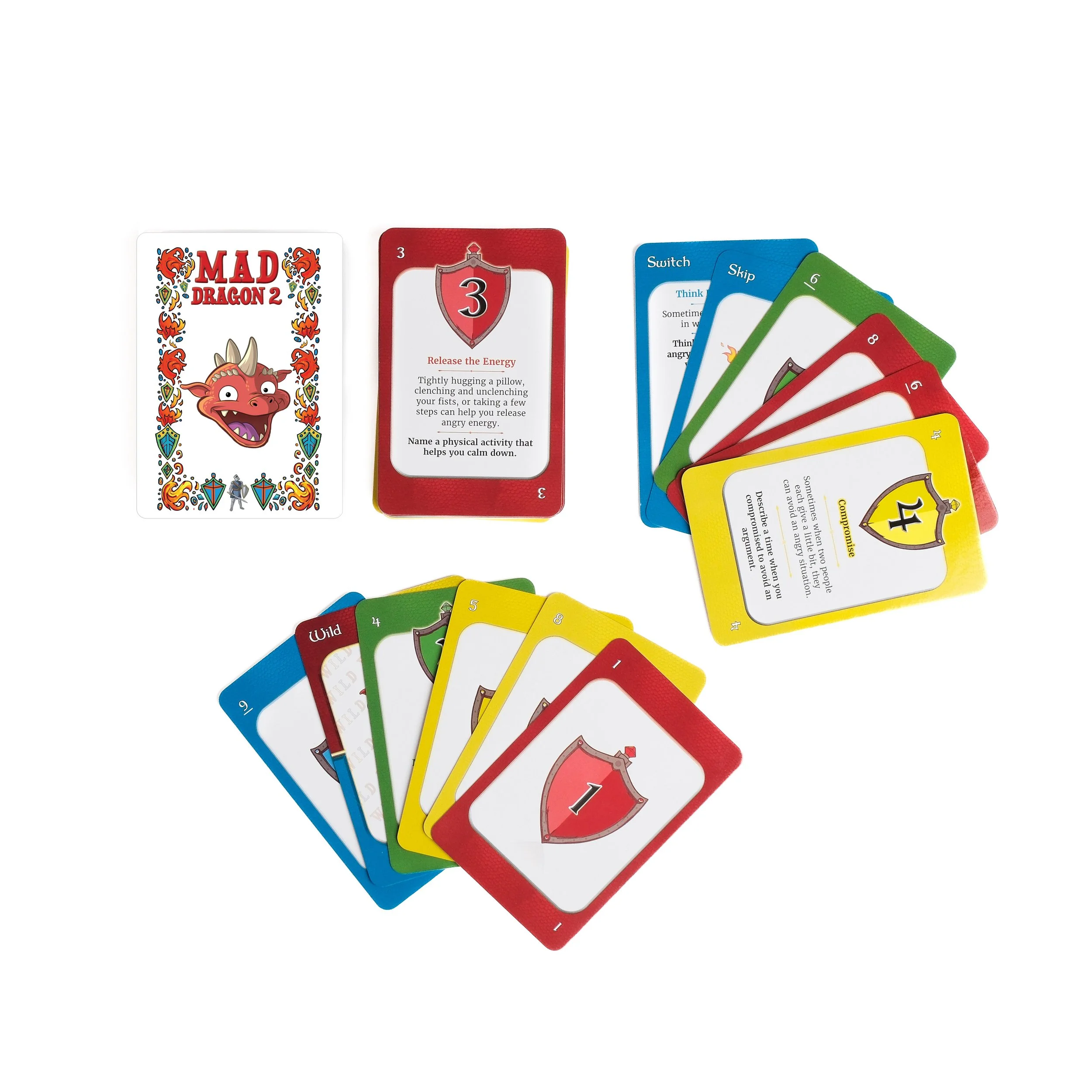 Cards from the game Mad Dragon 2, with colored cards featuring various numbers and instructions, some cards showing shield icons and others with text describing actions or powers.