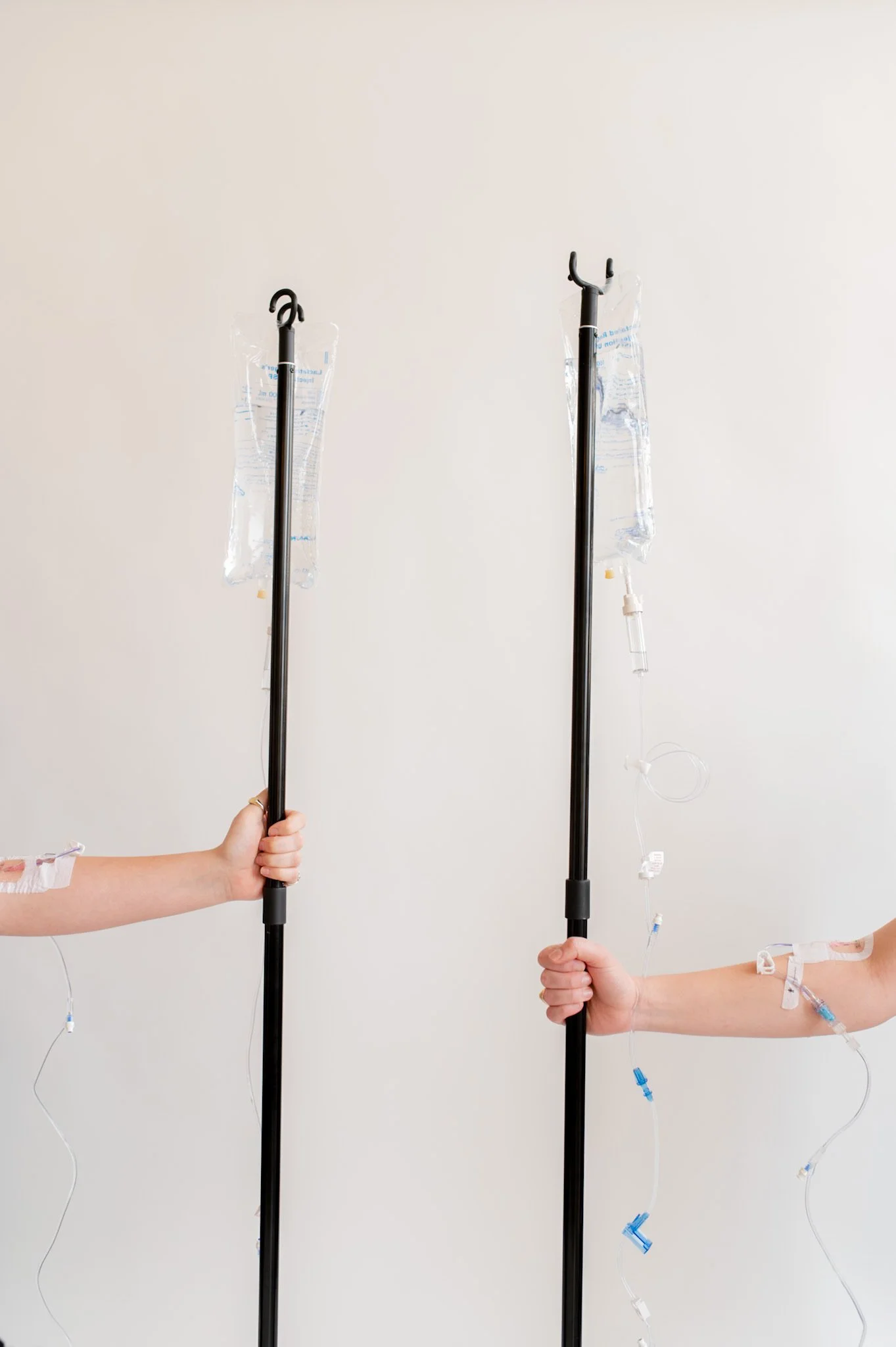 2 bags of IV fluids on poles