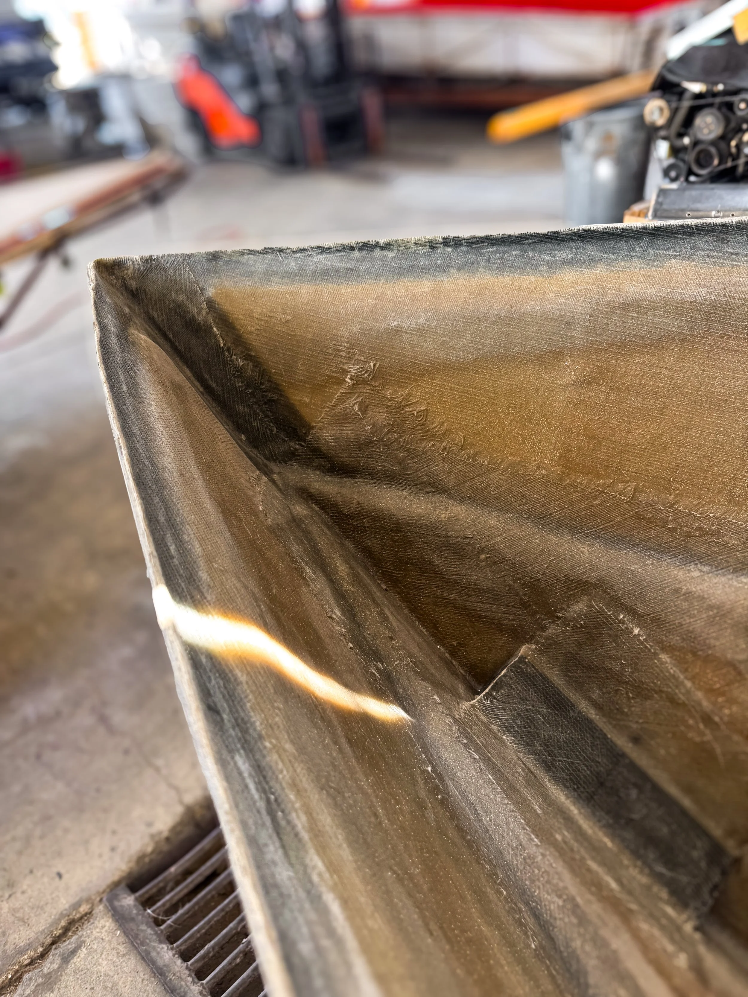 inside of a boat hull bow showing fiberglass and coring