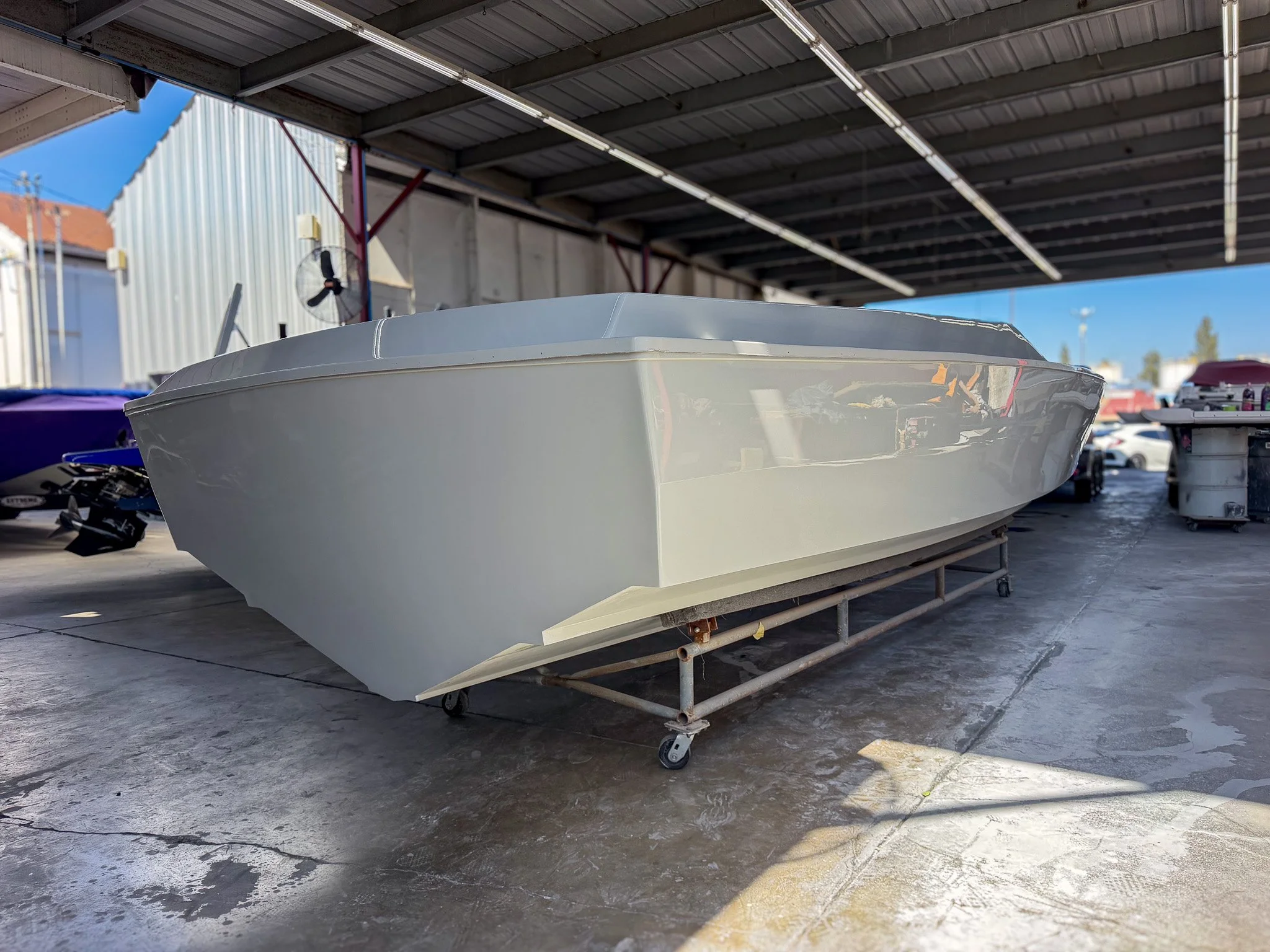 white boat hull transom made from fiberglass in a boat shop