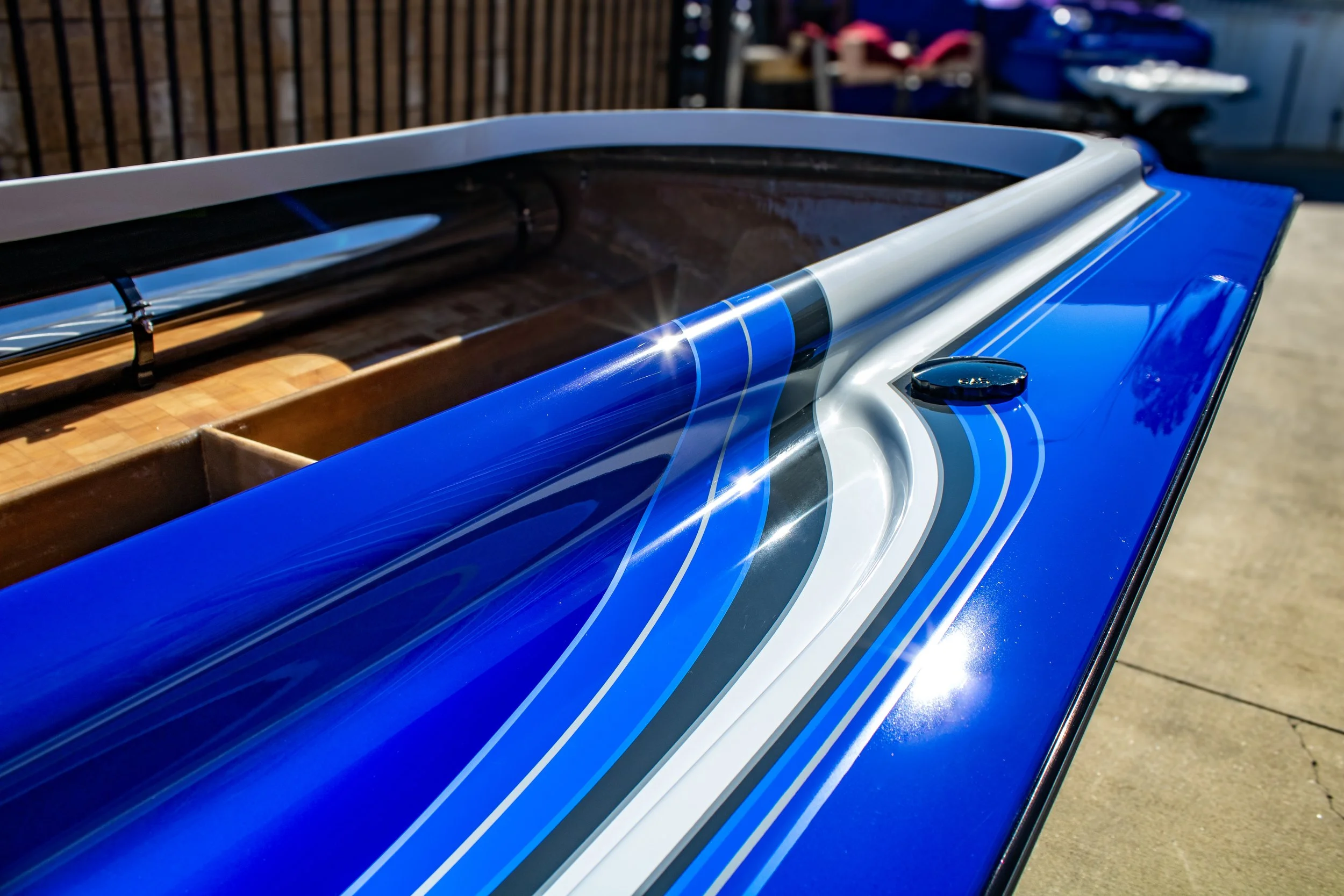 Close-up of a blue and white boat hull