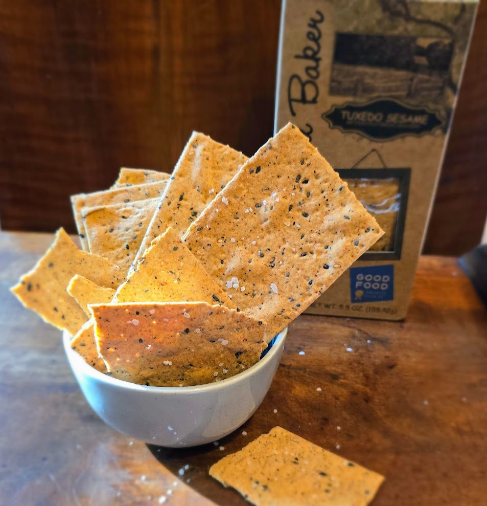 Bolstered by whole wheat flour and toasted sesame oil, our Tuxedo Sesame crackers are deliciously complex. Black and white sesame seeds give the crackers a richness, and roasted garlic complements the flavor to create a delightful cracker. It’s no wo