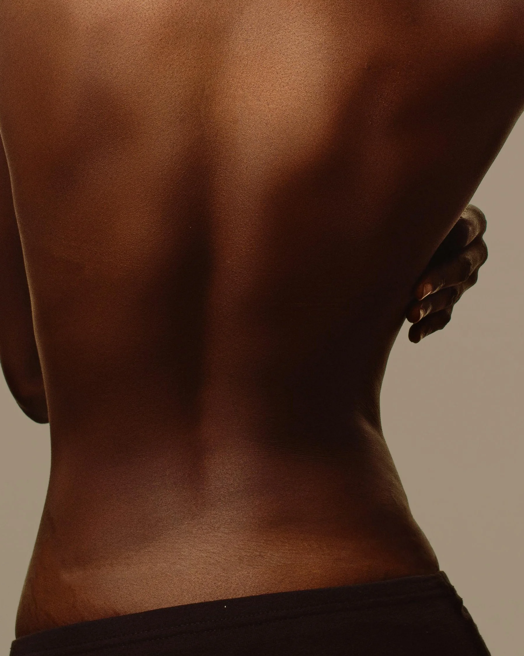Image of person's bare back.