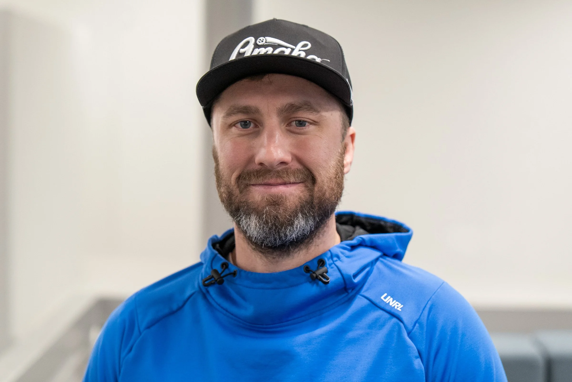 Paul Lanphier - Managing Partner - Arise Ventures - Photo of Paul smiling at the camera in front of a bright background.