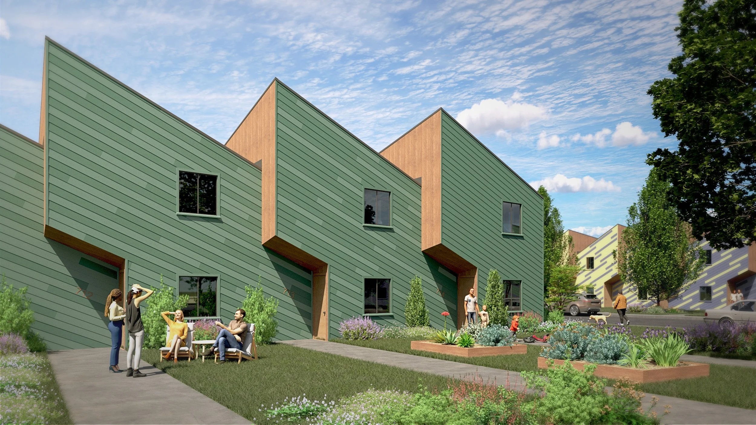AFFORDABLE TOWNHOMES: a row of dynamic sculptural facades behind grassy front lawns.