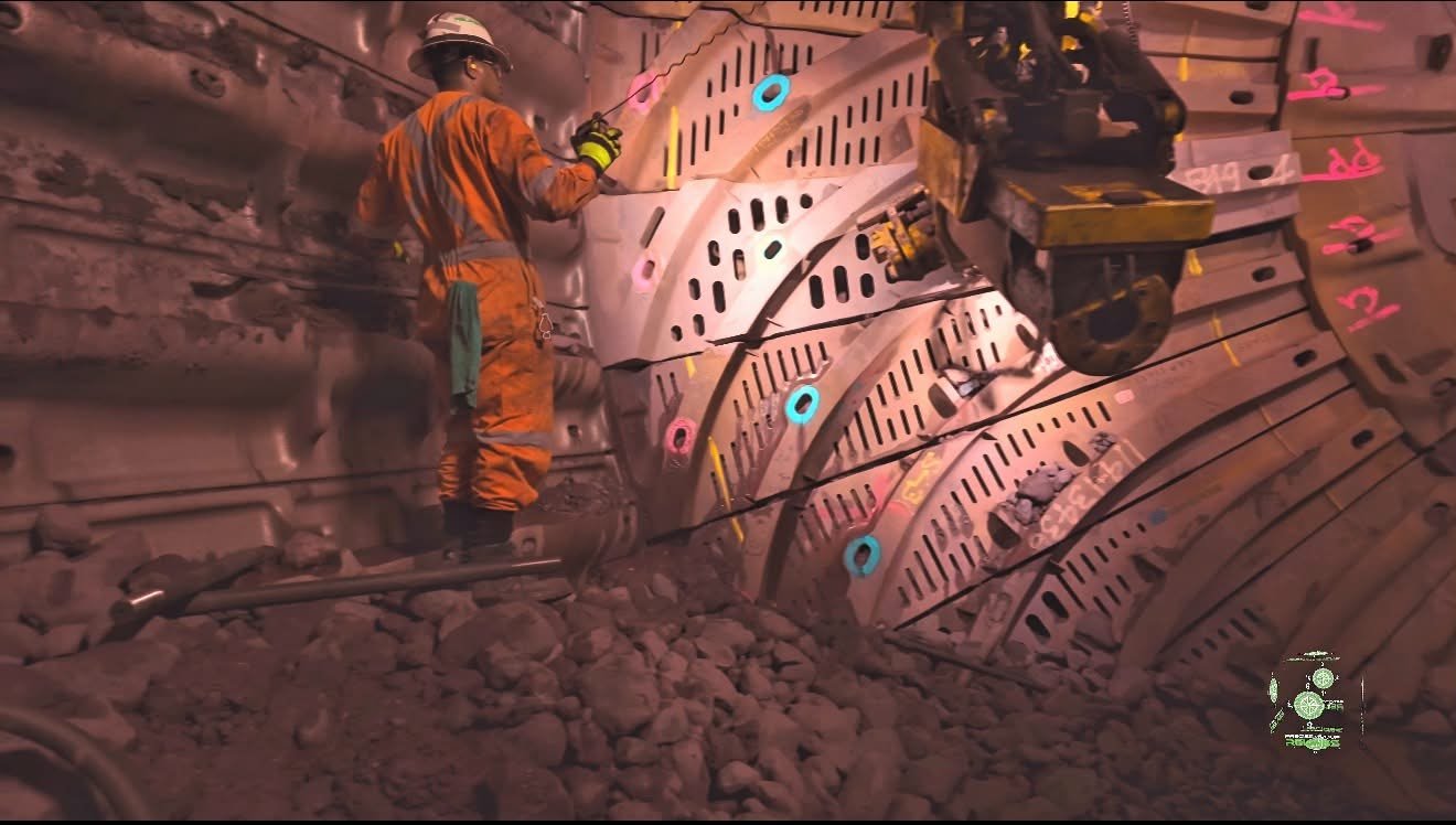 Workers inside the mill with the Russell machine