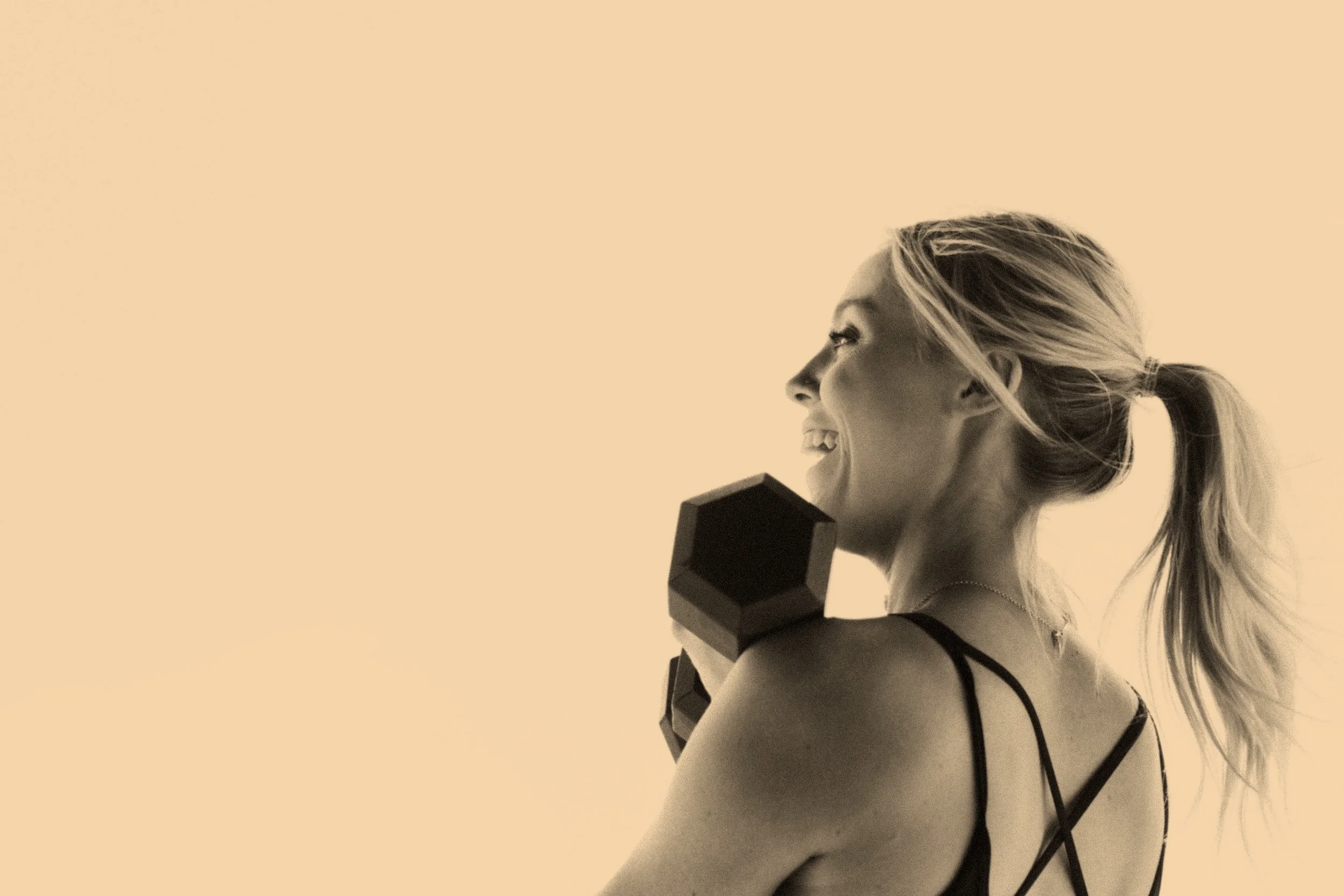 A woman lighting weights as part of her longevity plan