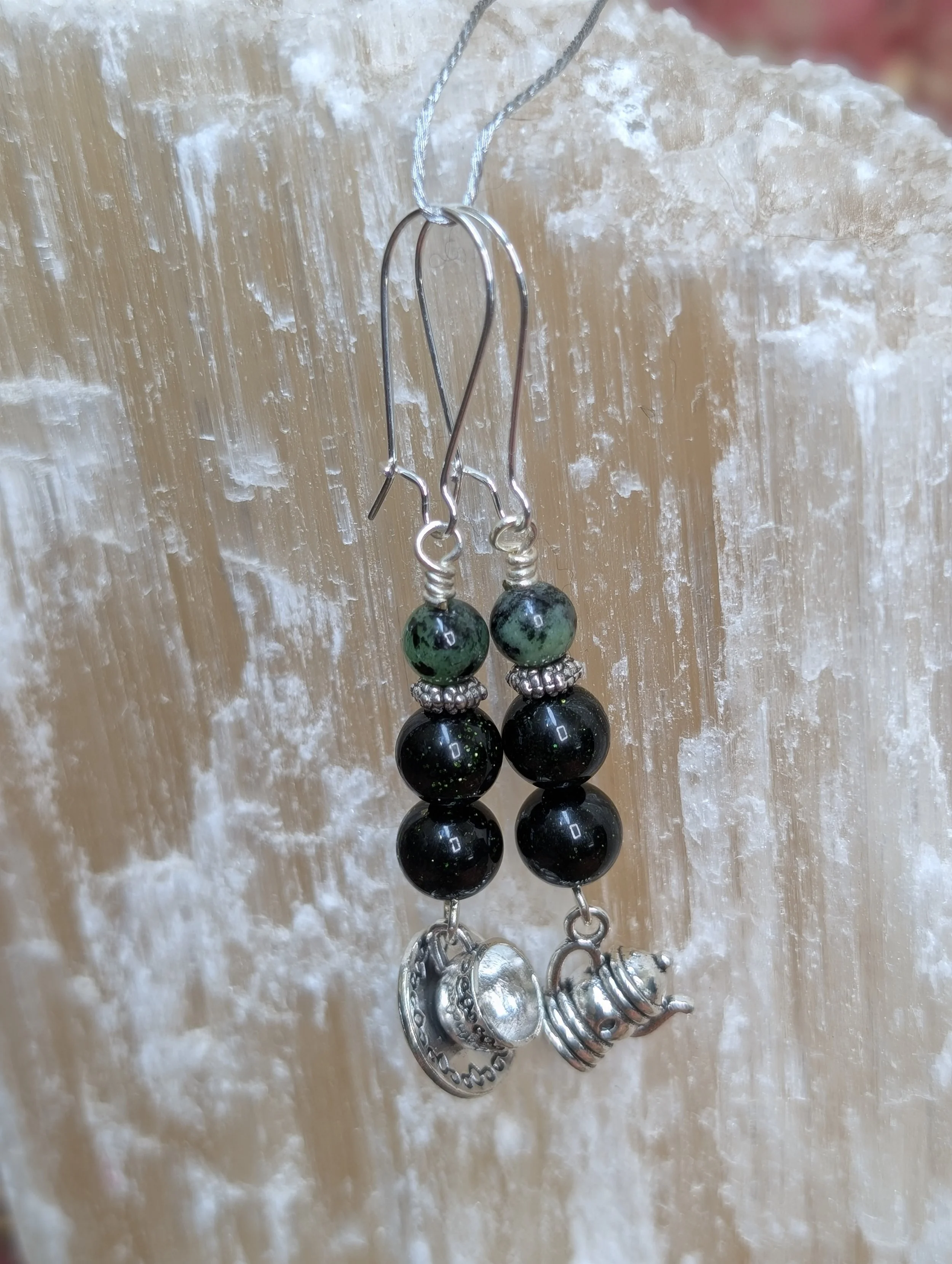 Earrings made of Ruby Zoisite and Green Goldstone with teapot and teacup charms