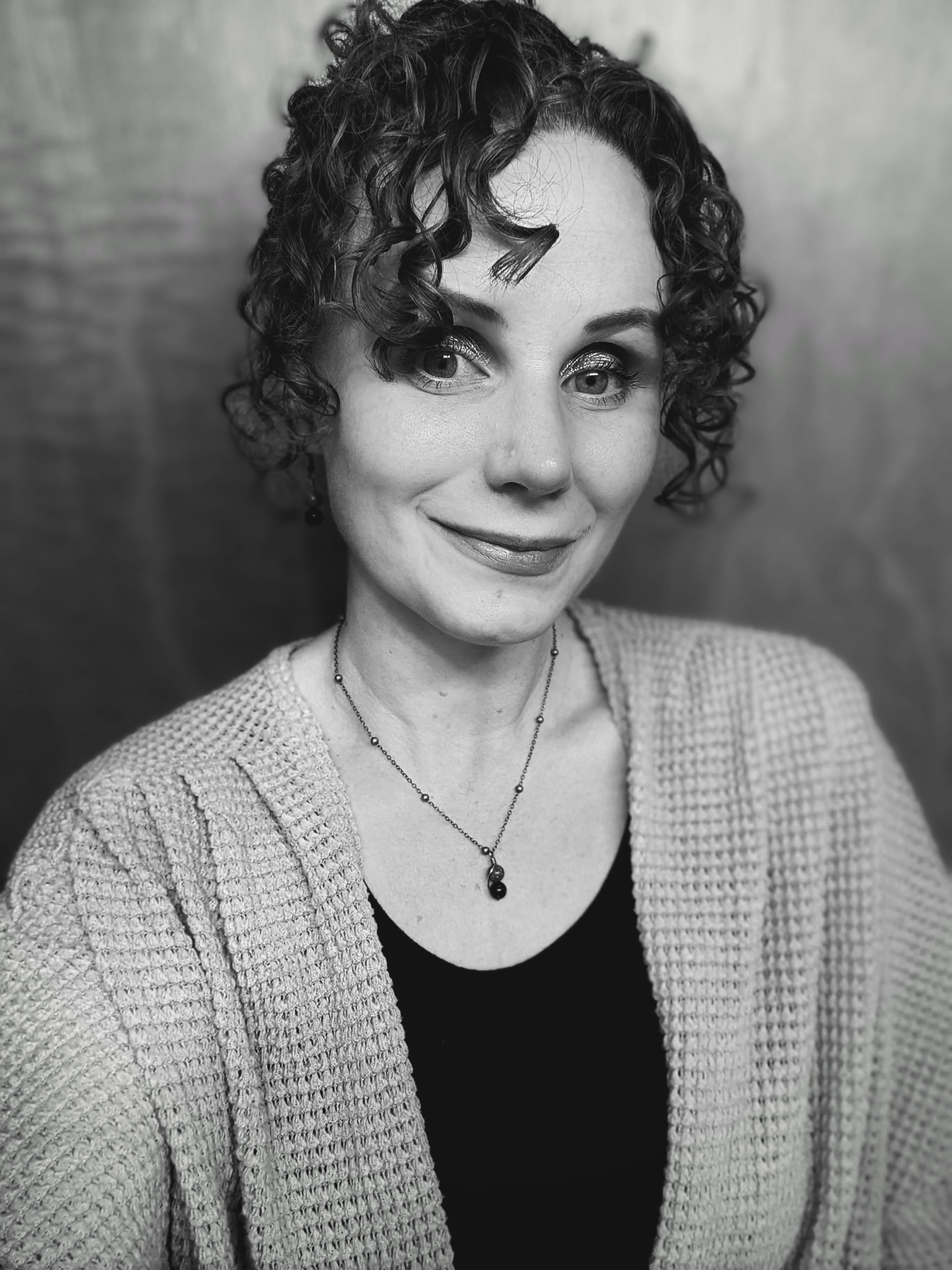 A black and white portrait of Amanda.