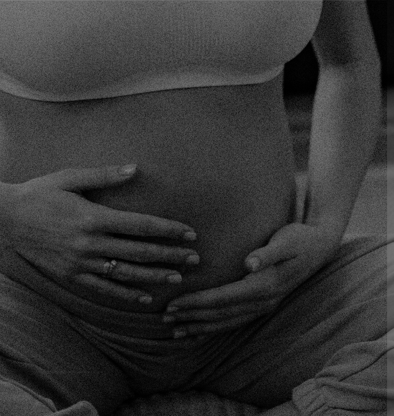 Hands resting on a pregnant belly
