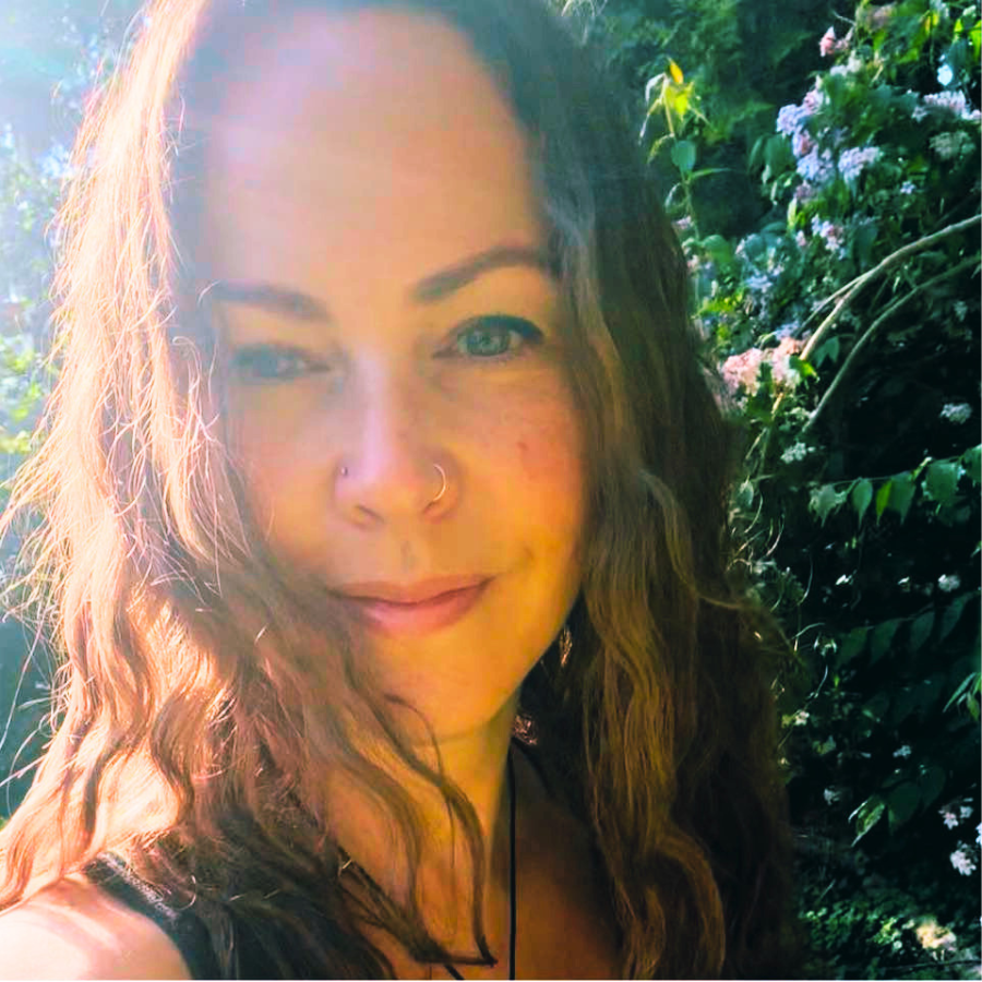 A headshot of Lisa Brake enjoying the sunshine