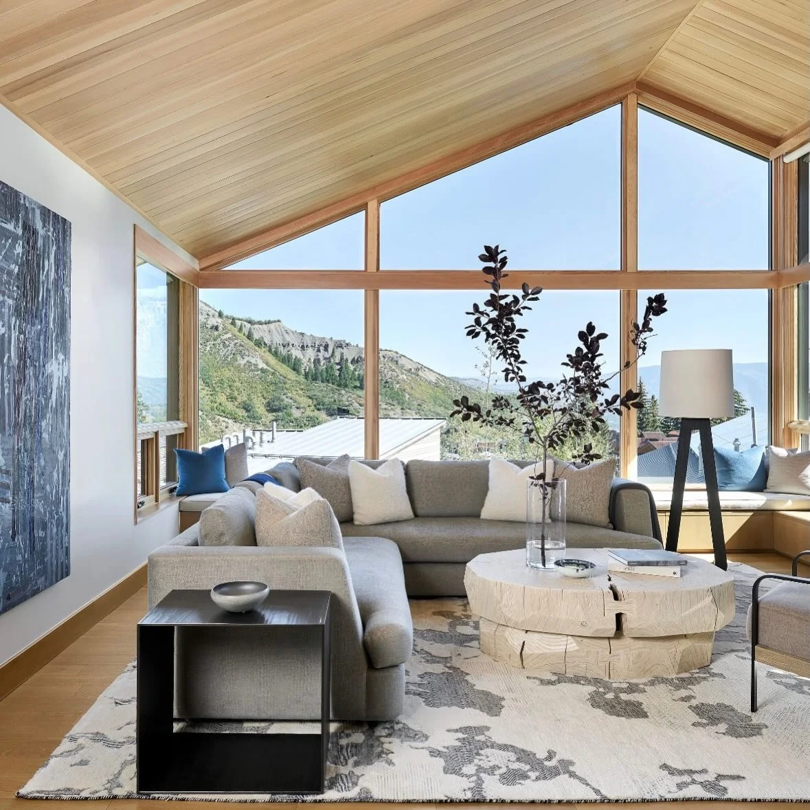 Snowmass Slopeside - where adventure meets relaxation! Imagine stepping off the slopes directly into this curated, cozy oasis. This Havens residence has just that. We designed this modern ski in/ski out living room to blur the lines between rugged Mo