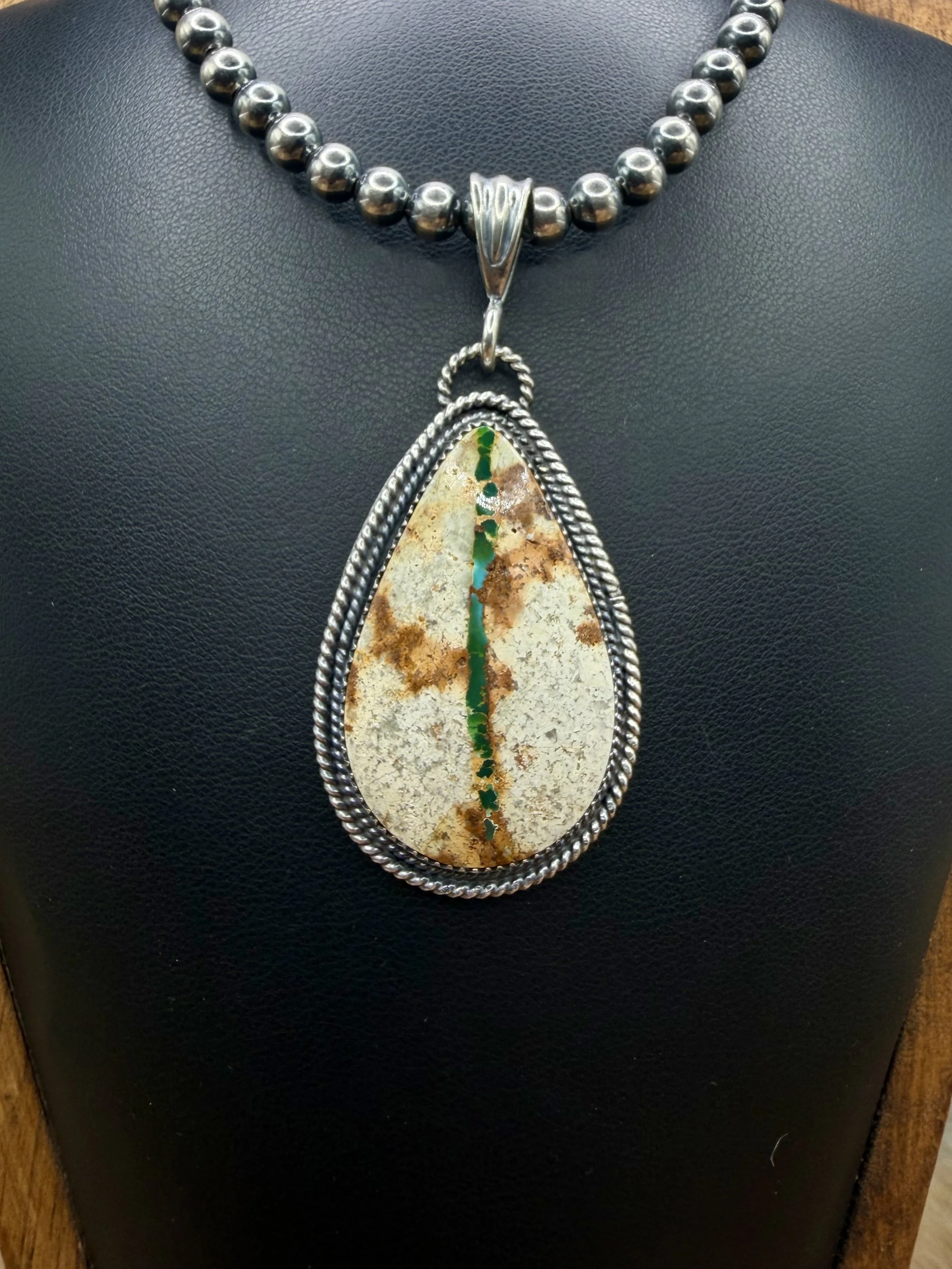 The River Rolls Pendant