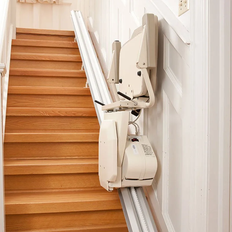 A stairlift installed on a wooden staircase.