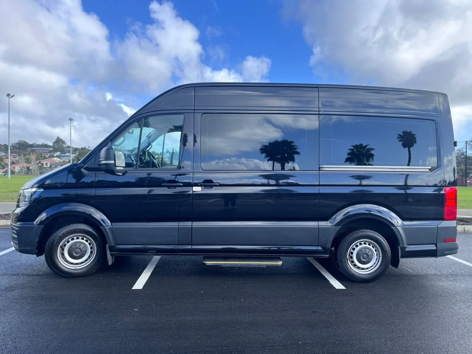 Gulf Tours NZ 11 seater luxury minivan with USB/USC charging stations, reclining chairs, enhanced PA system and luggage compartment