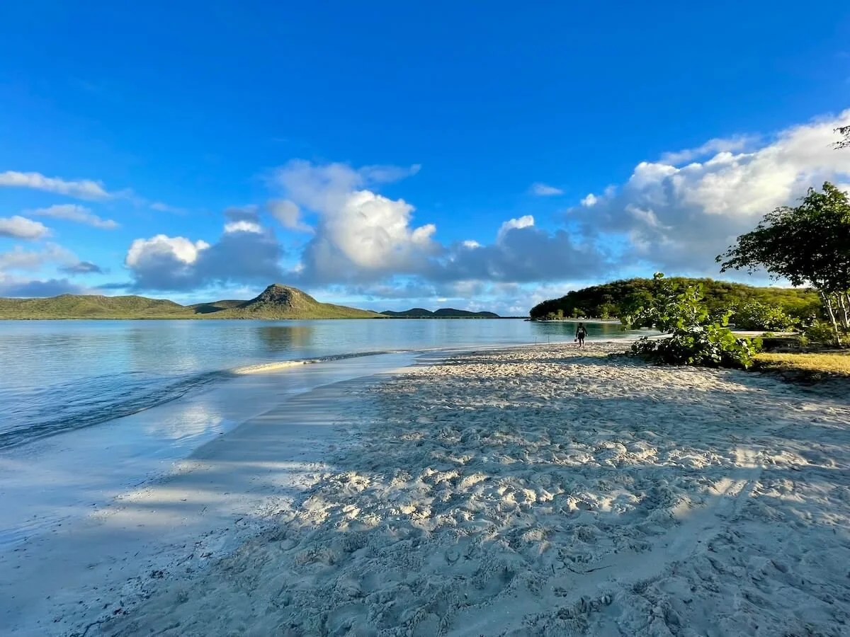 Seaforth Beach in Antigua with very calm water and pristine landscape in the background