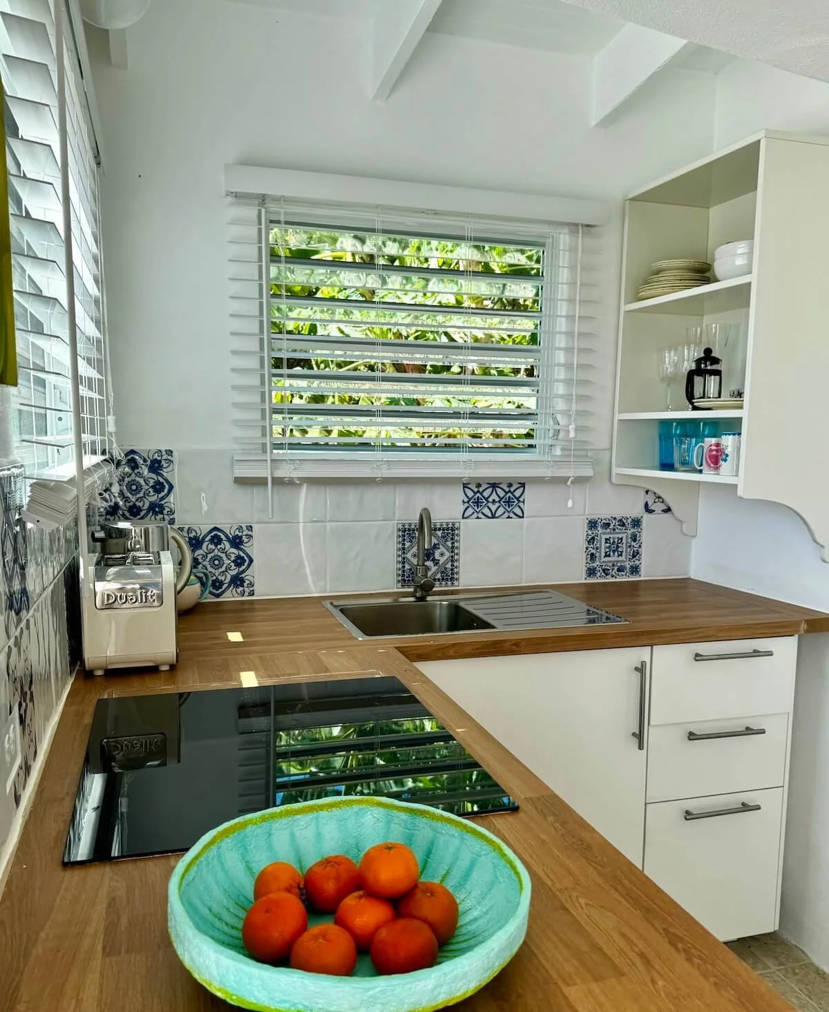 The kitchen at the studio apartment in Antigua for The Sea Change Retreat with everything you need to feel at home, relax and receive your new era.