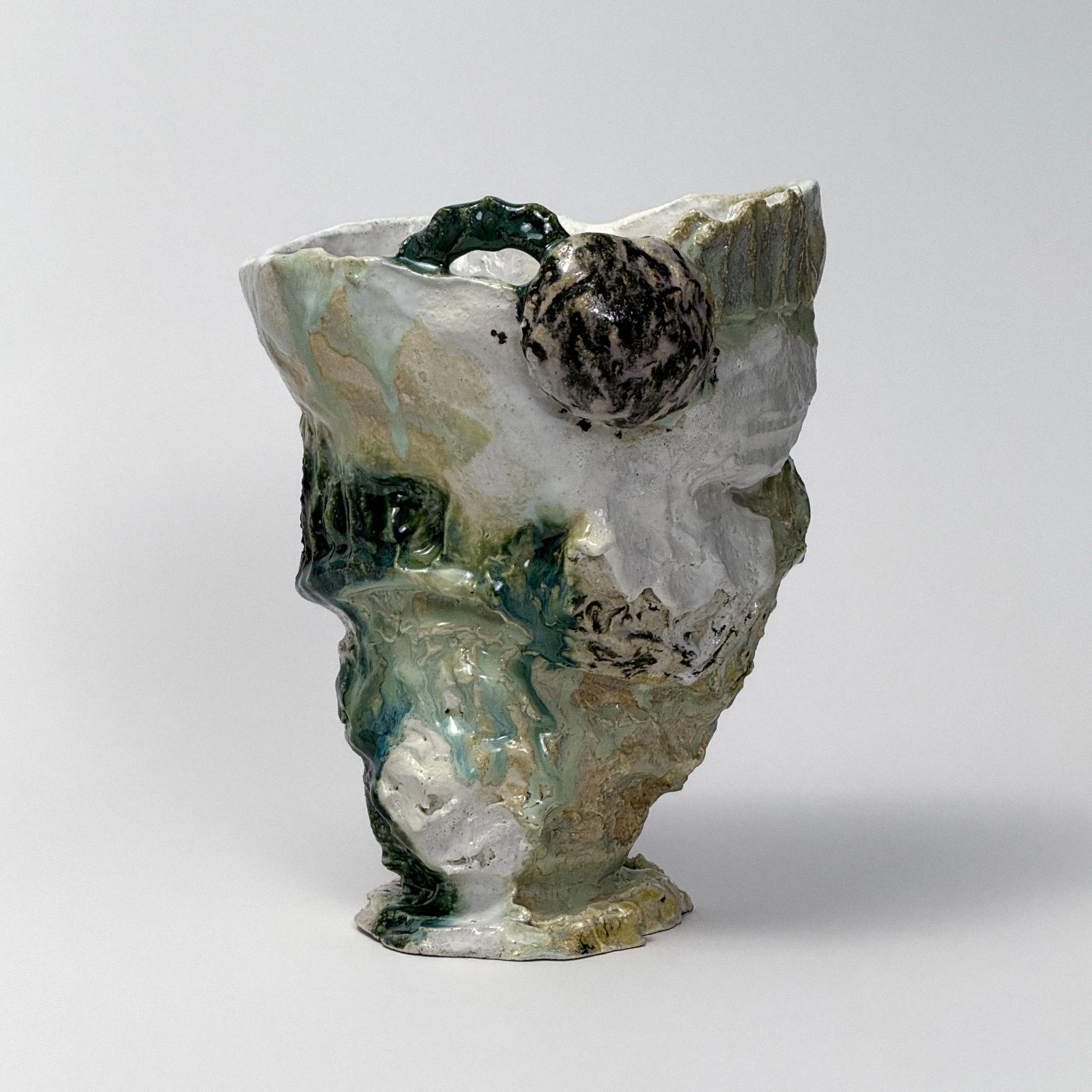 Green and white sculptural abstract vase