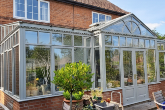 Modern Redbrick House (Nether Poppleton, York). Here, the focus was on modernising the front elevation of a redbrick home. The window frames and detailing were repainted in grey to create contrast with the brick. Access around tight garden edges made