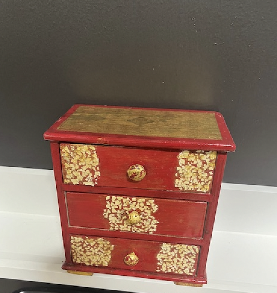 Catherine Engelmeyer art eggshells on red box.png