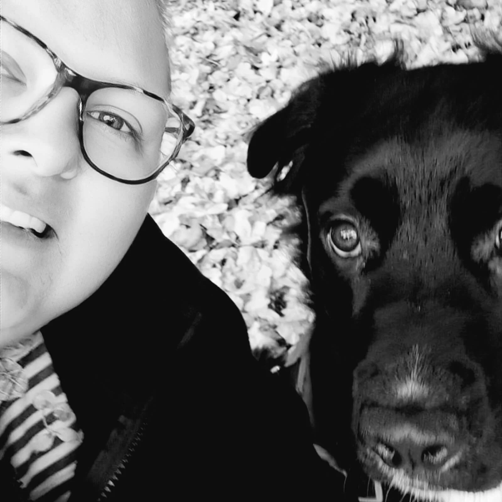 black and white image of a owner with her dog