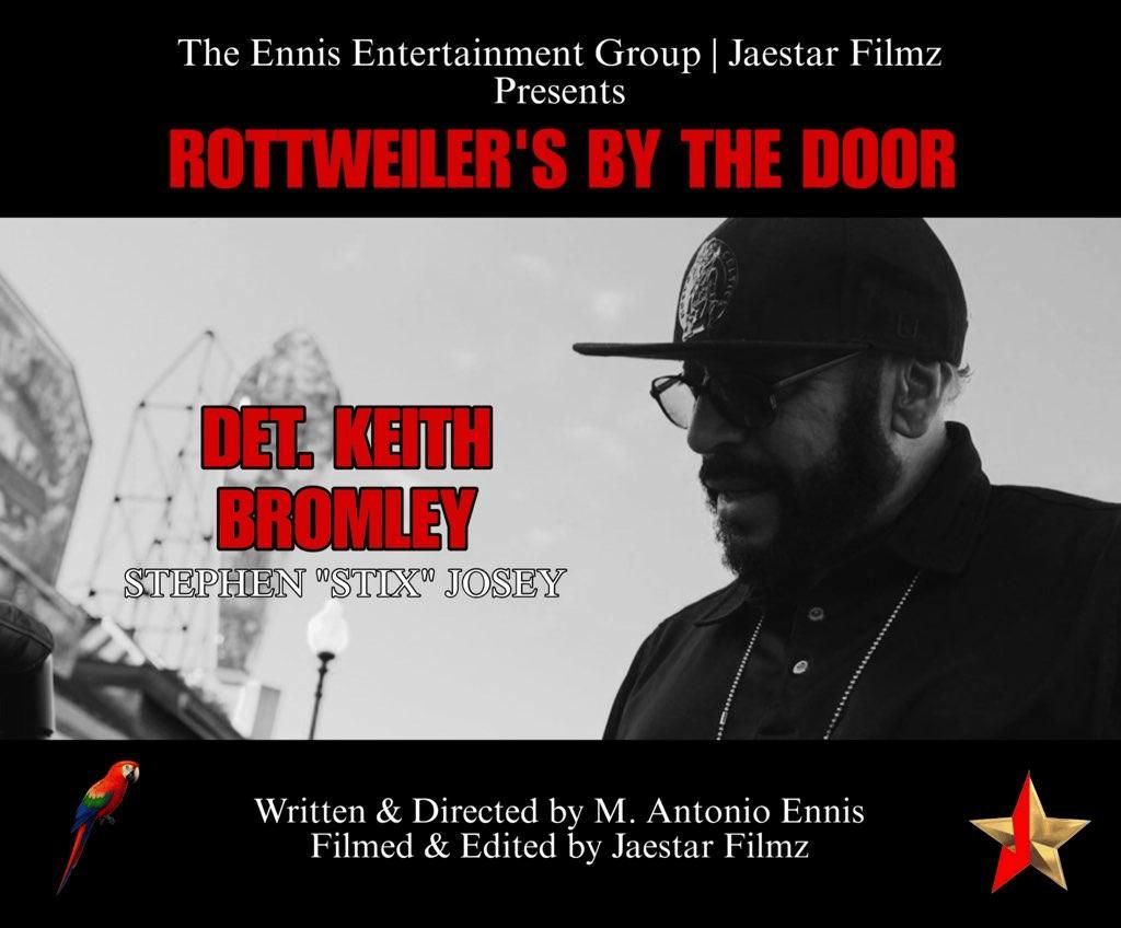 A promotional poster for a production of "Rottweiler's by the Door" presented by The Ennis Entertainment Group and Jaestar Filmz. The poster features a black-and-white photo of a man wearing glasses, a baseball cap, and a chain necklace. His face is 
