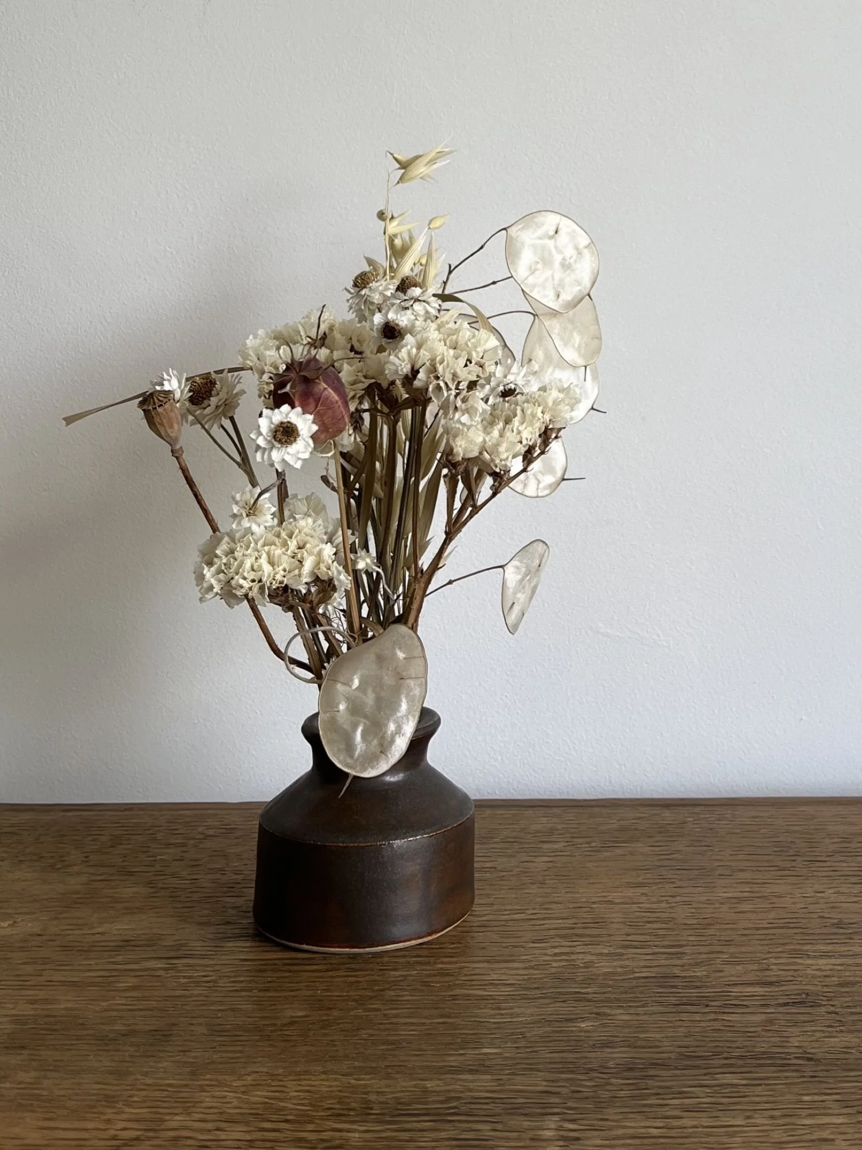 hand made stoneware bud vase with flowers