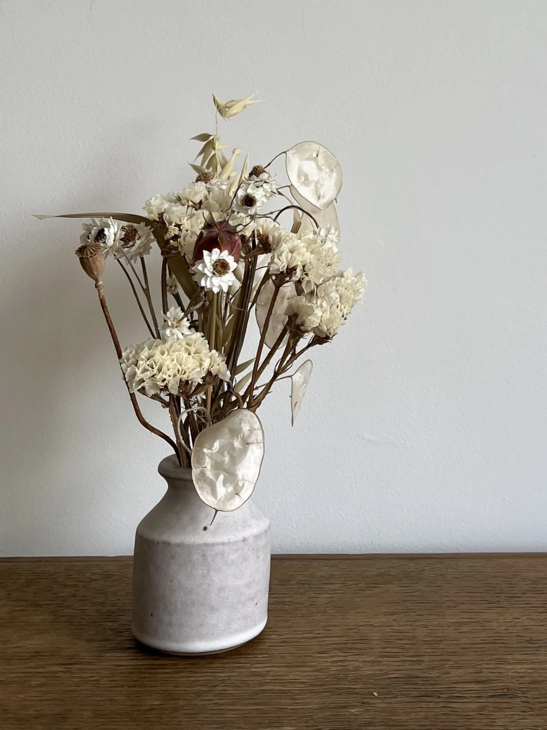 hand made stoneware bud vase with flowers