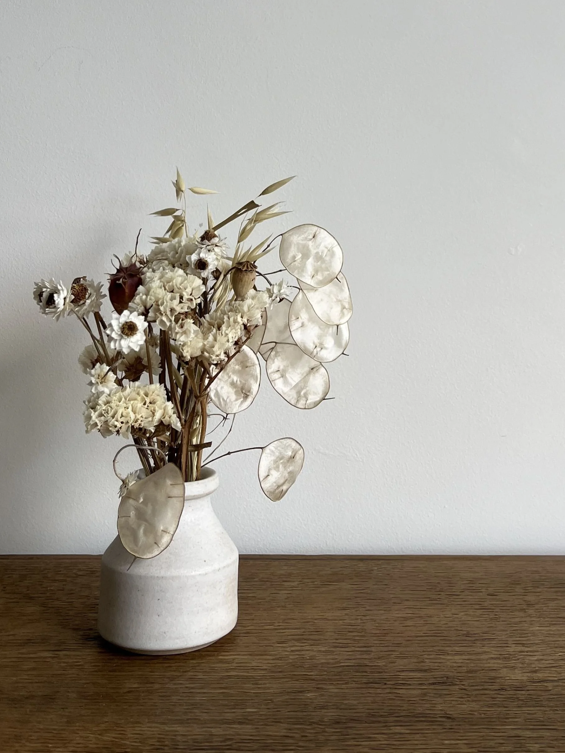 hand made stoneware bud vase with flowers