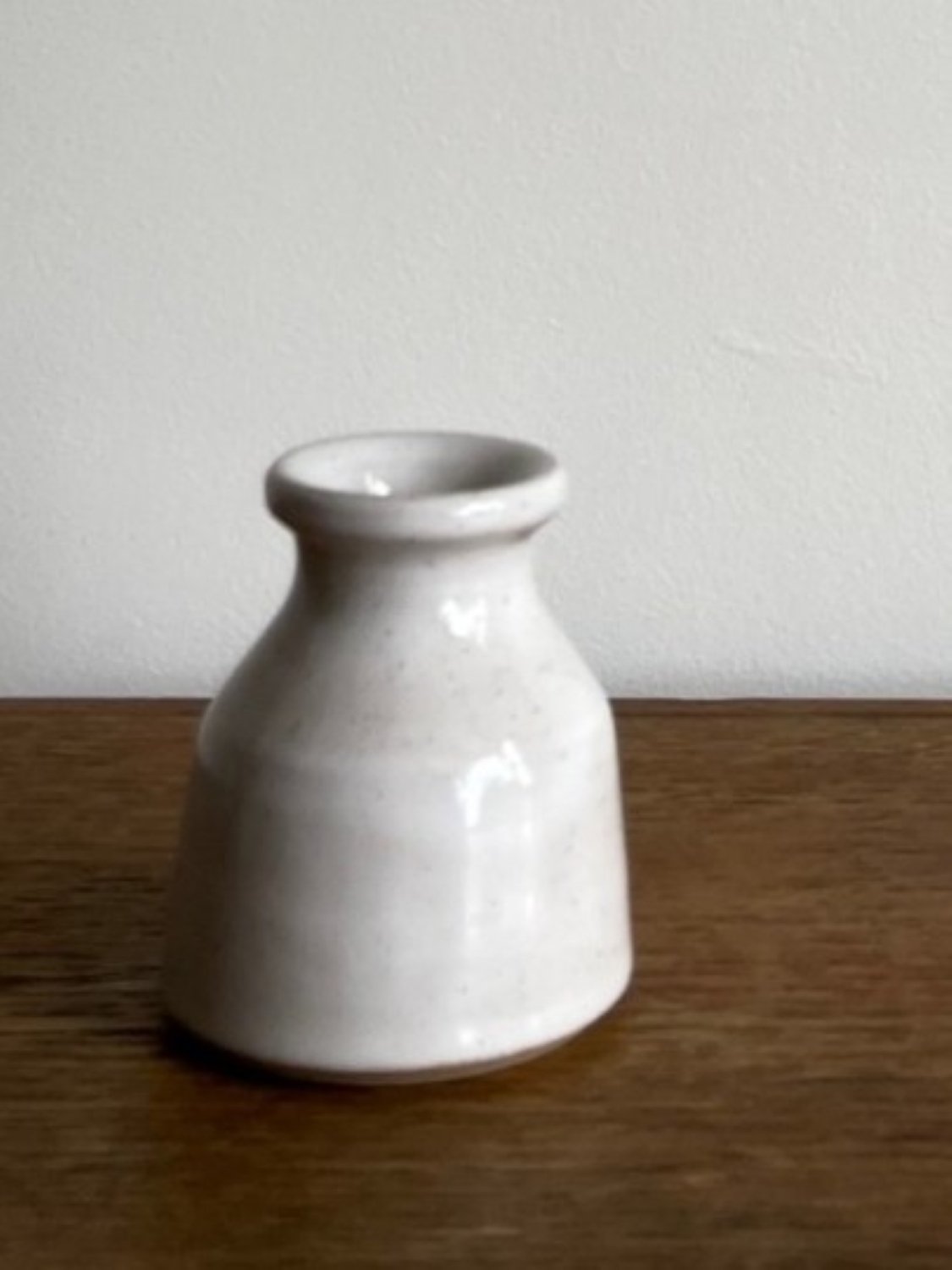 Hand made stoneware bud vase in a glossy white glaze