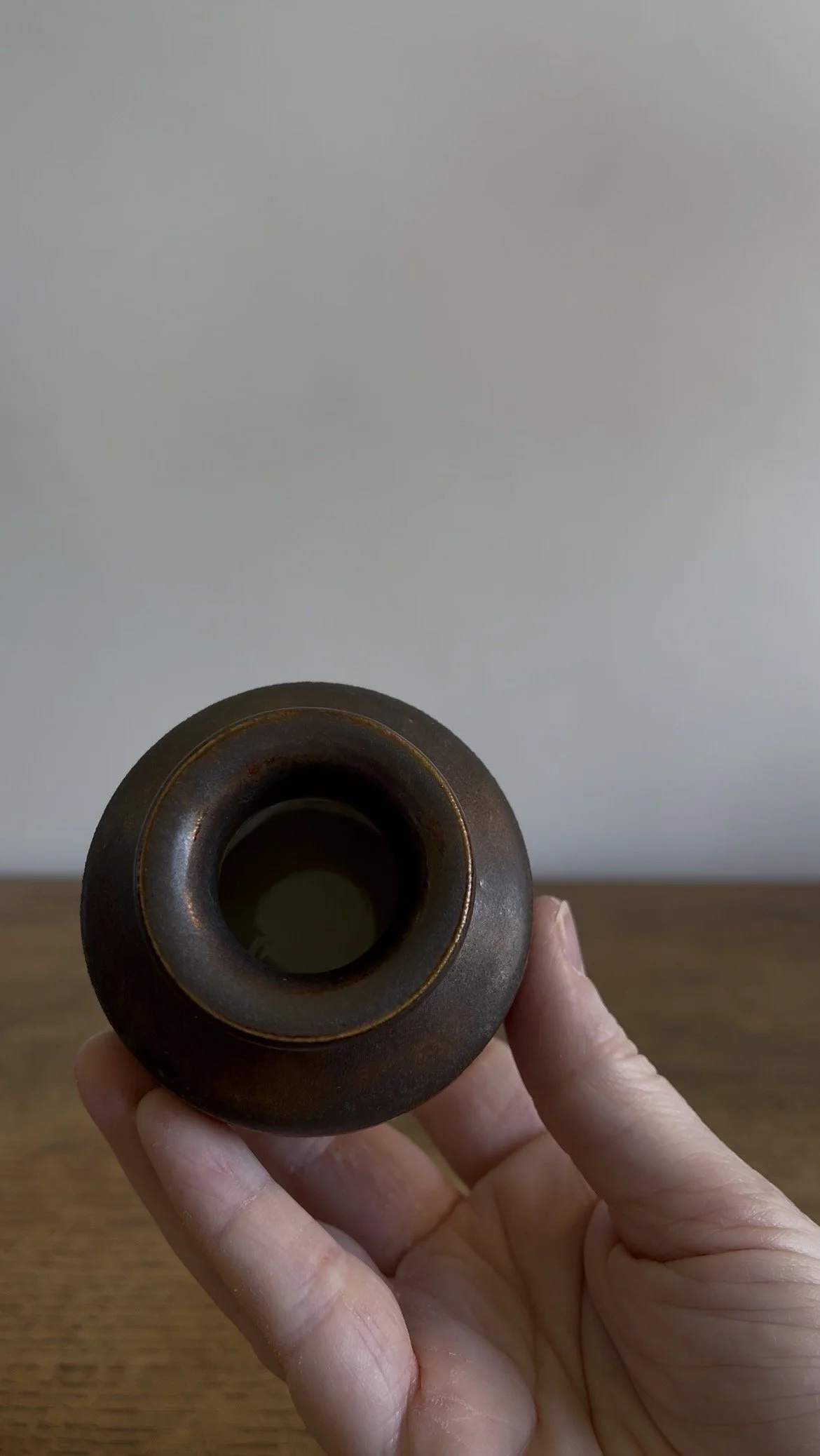 Handmade Stoneware Bud Vase in a deep bown glaze.