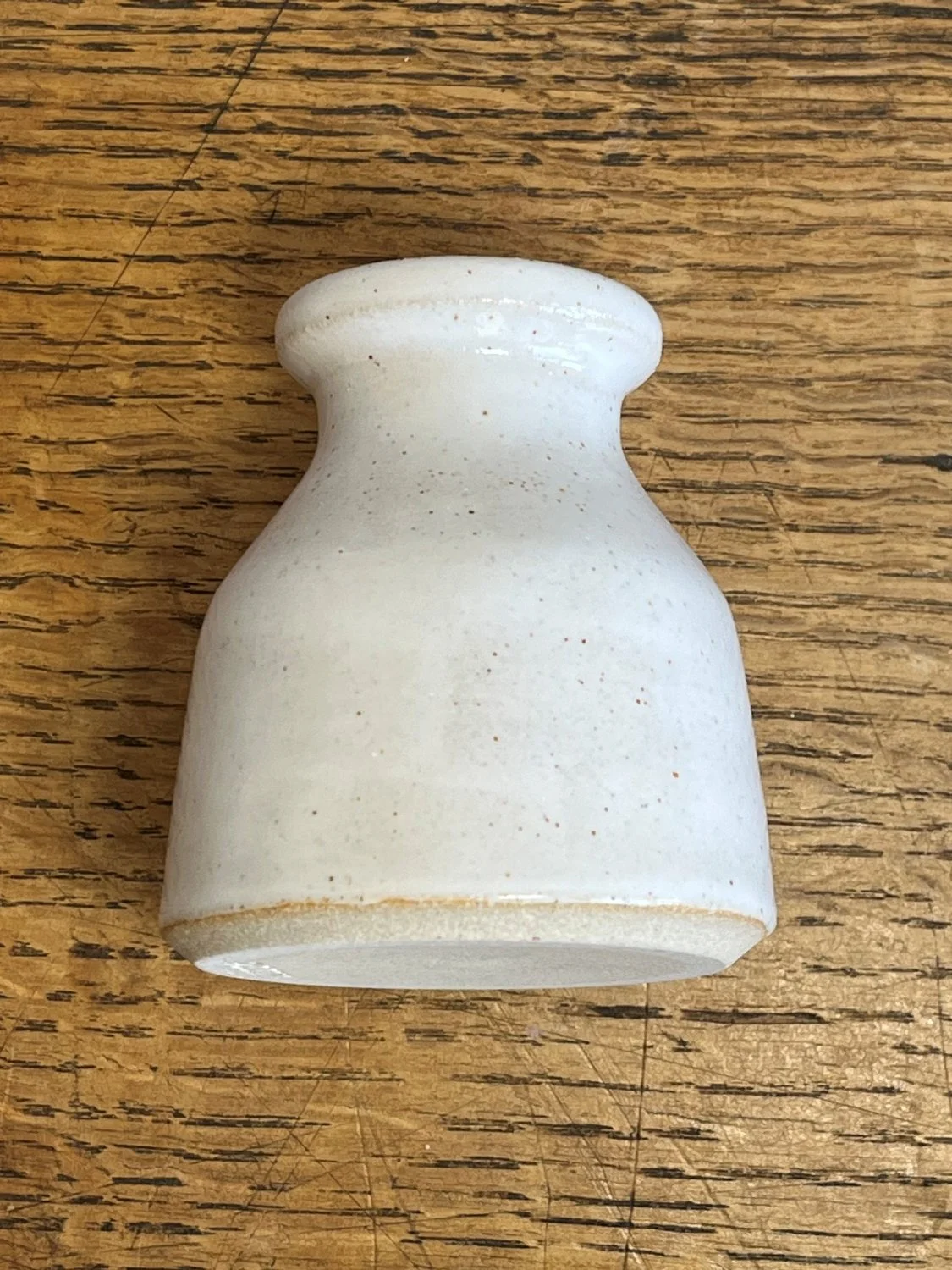 Hand made stoneware bud vase in a glossy white glaze