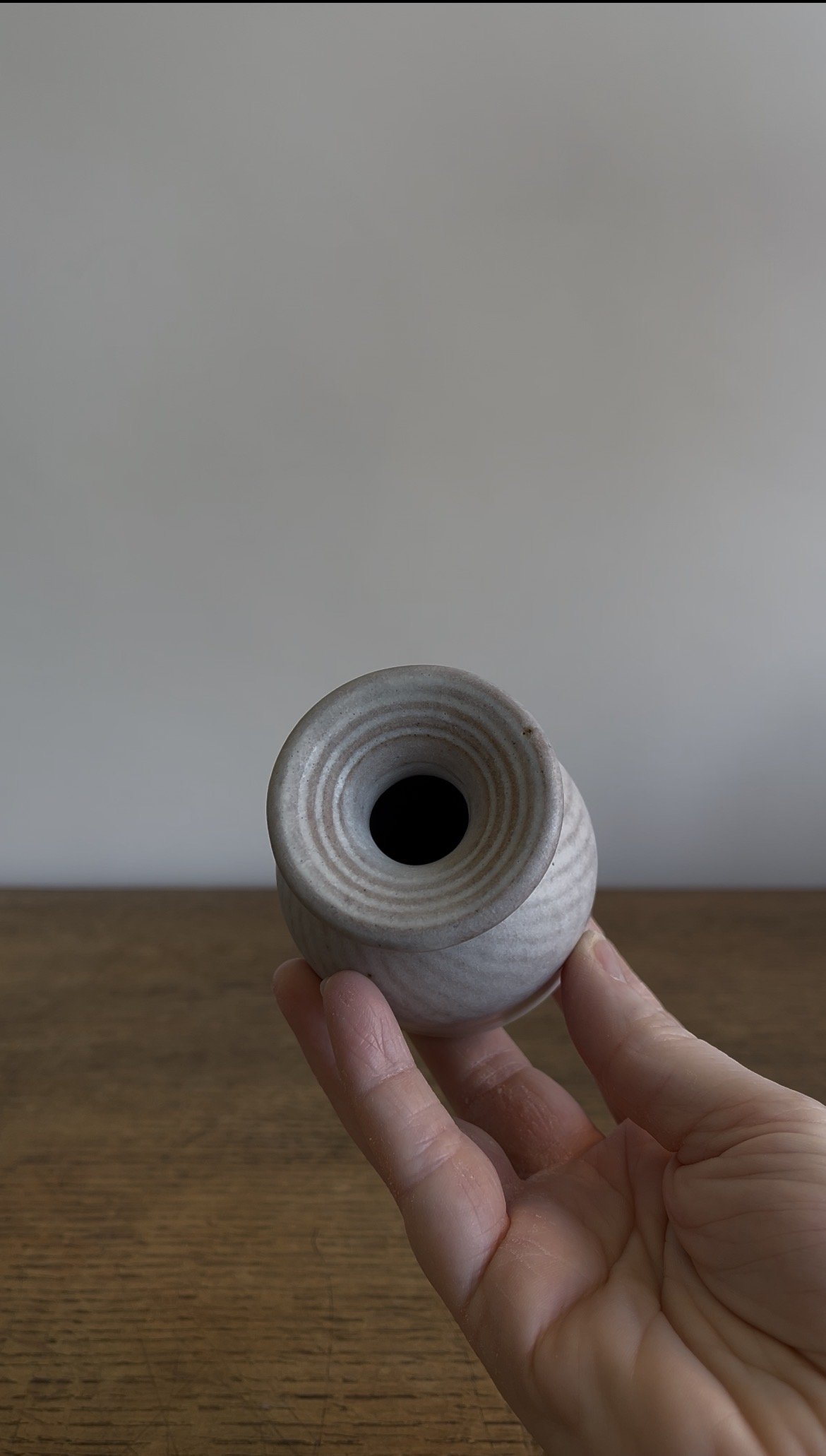 Handmade Stoneware Bud Vase with Carving Detail in an off-white satin glaze.