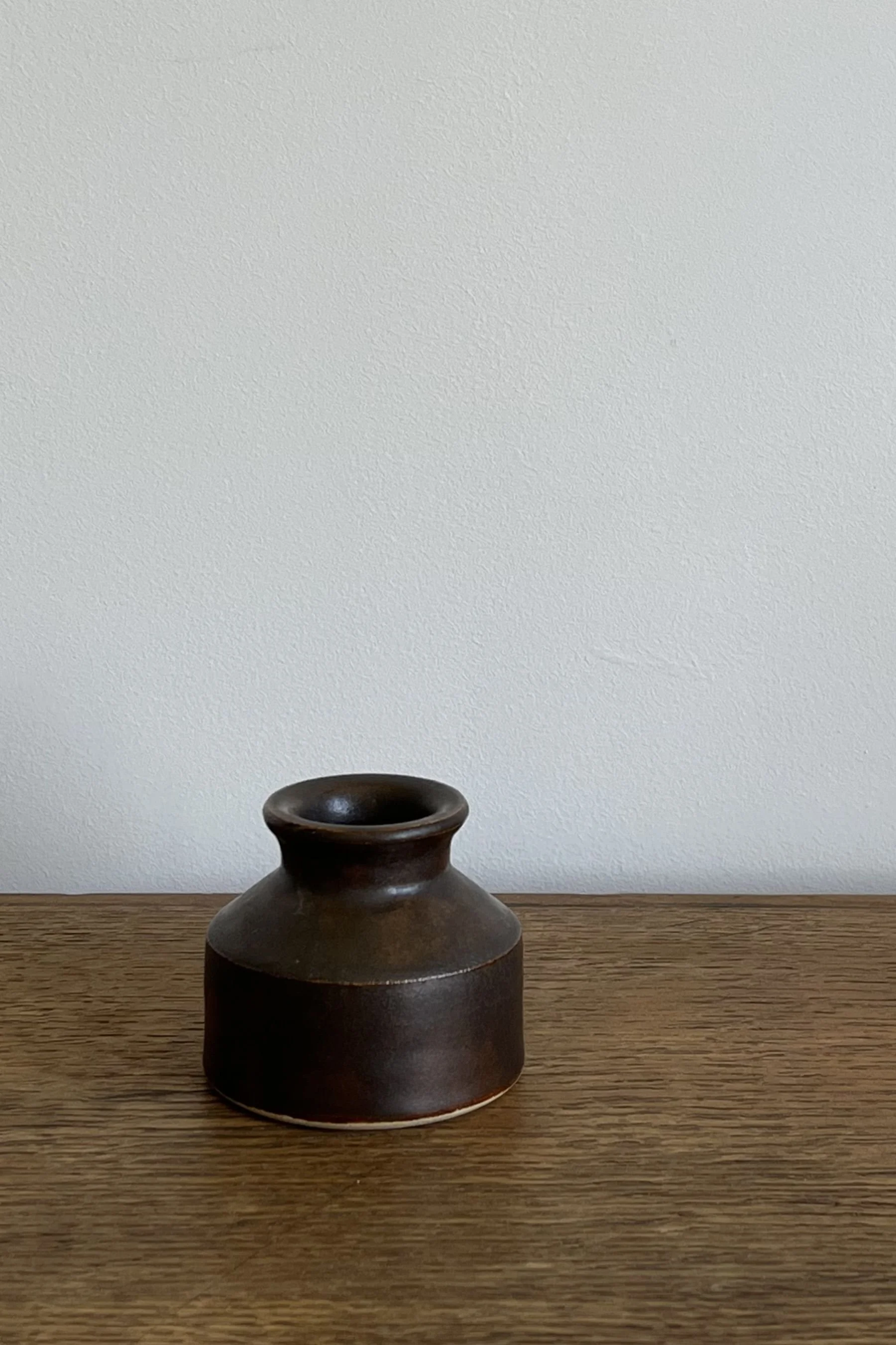 Handmade Stoneware Bud Vase in a deep bown glaze.
