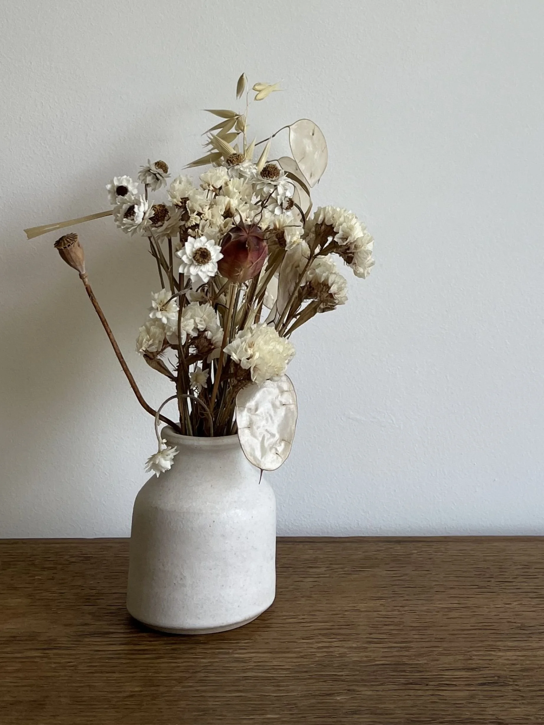 hand made stoneware bud vase with flowers