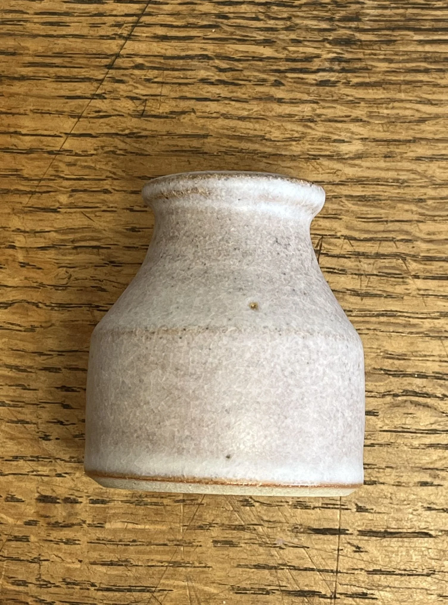 hand made stoneware bud vase in an off-white glaze