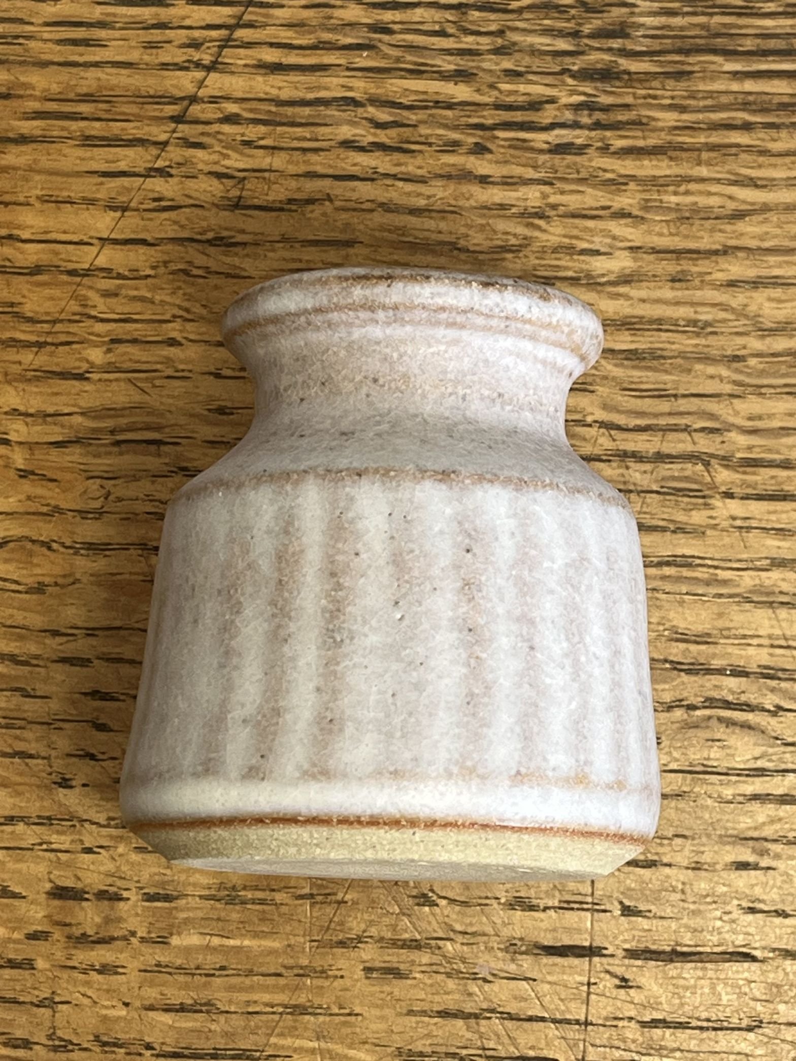 hand made stoneware bud vase with carved detail