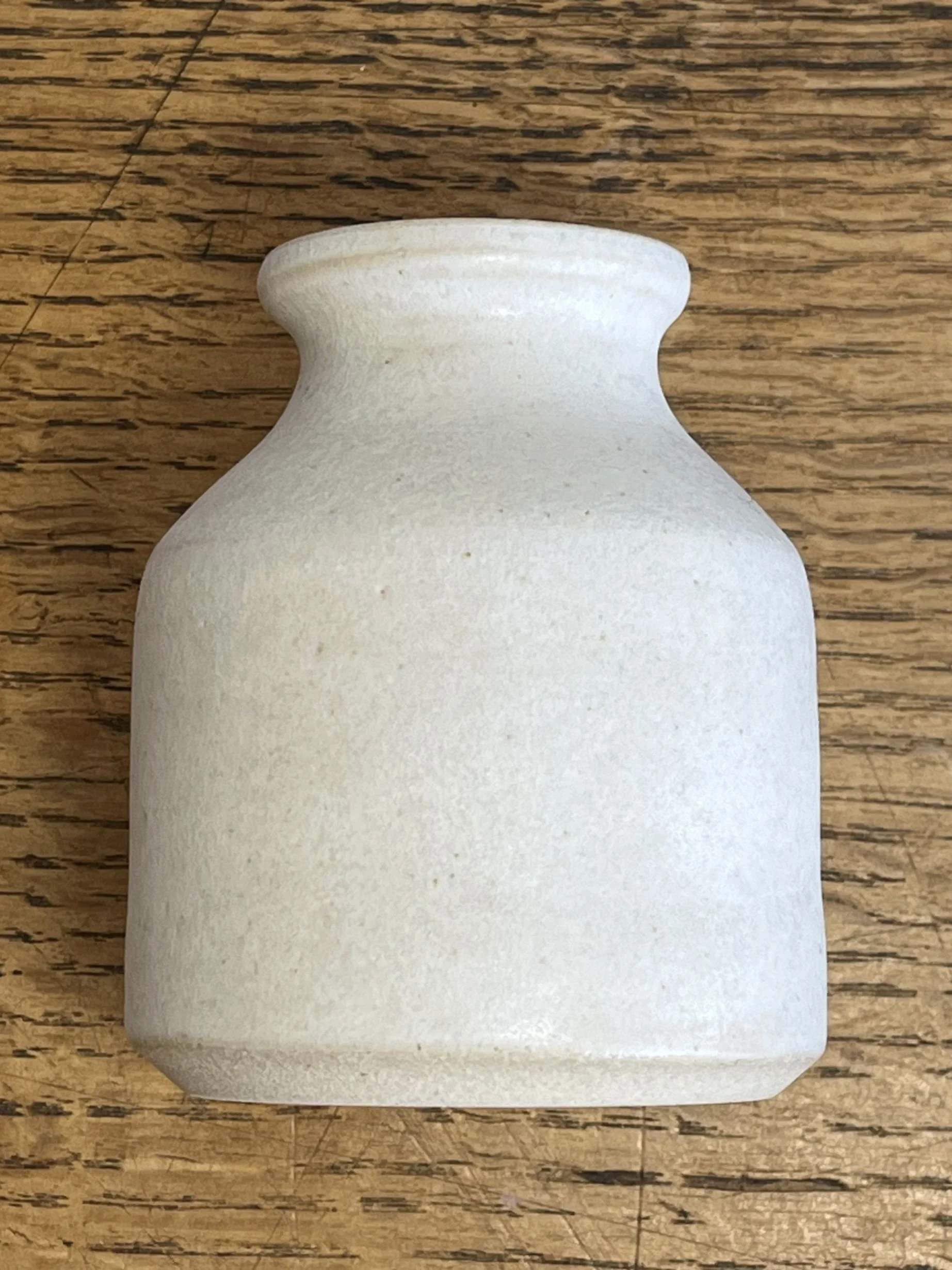 hand made stoneware bud vase in a matt white glaze