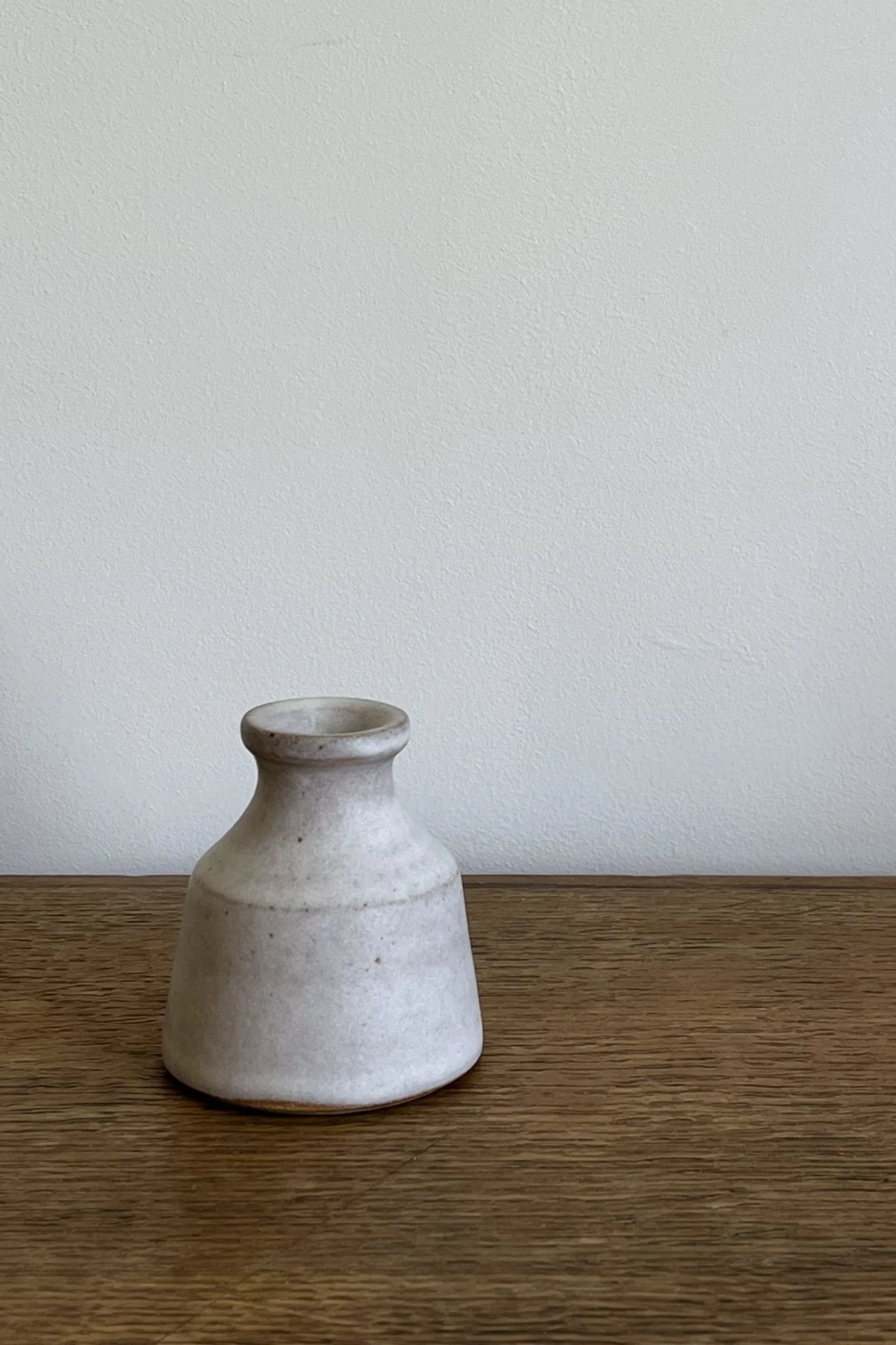 Handmade Stoneware Bud Vase in an off-white satin glaze.
