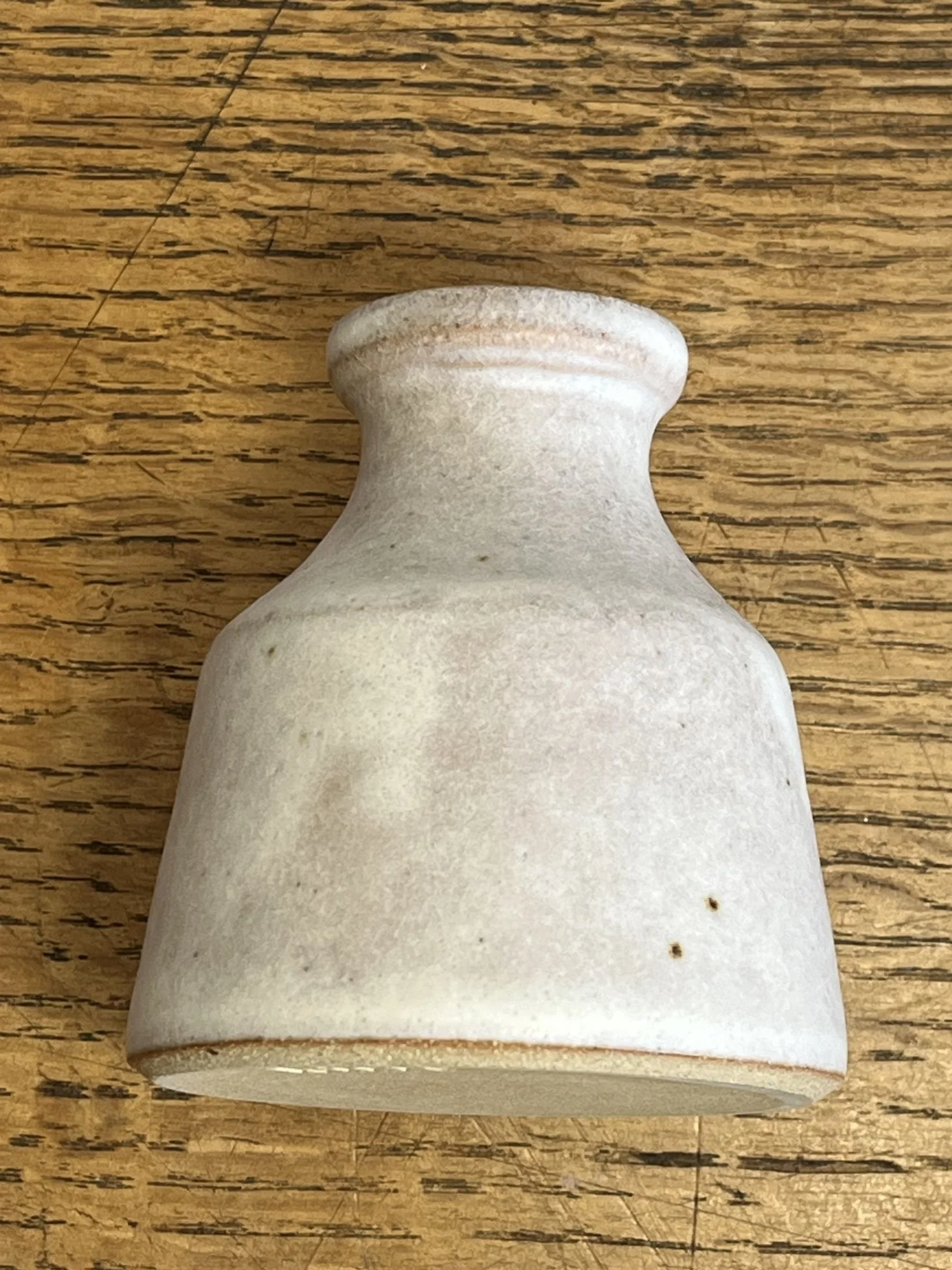 hand made stoneware bud vase in an off-white glaze