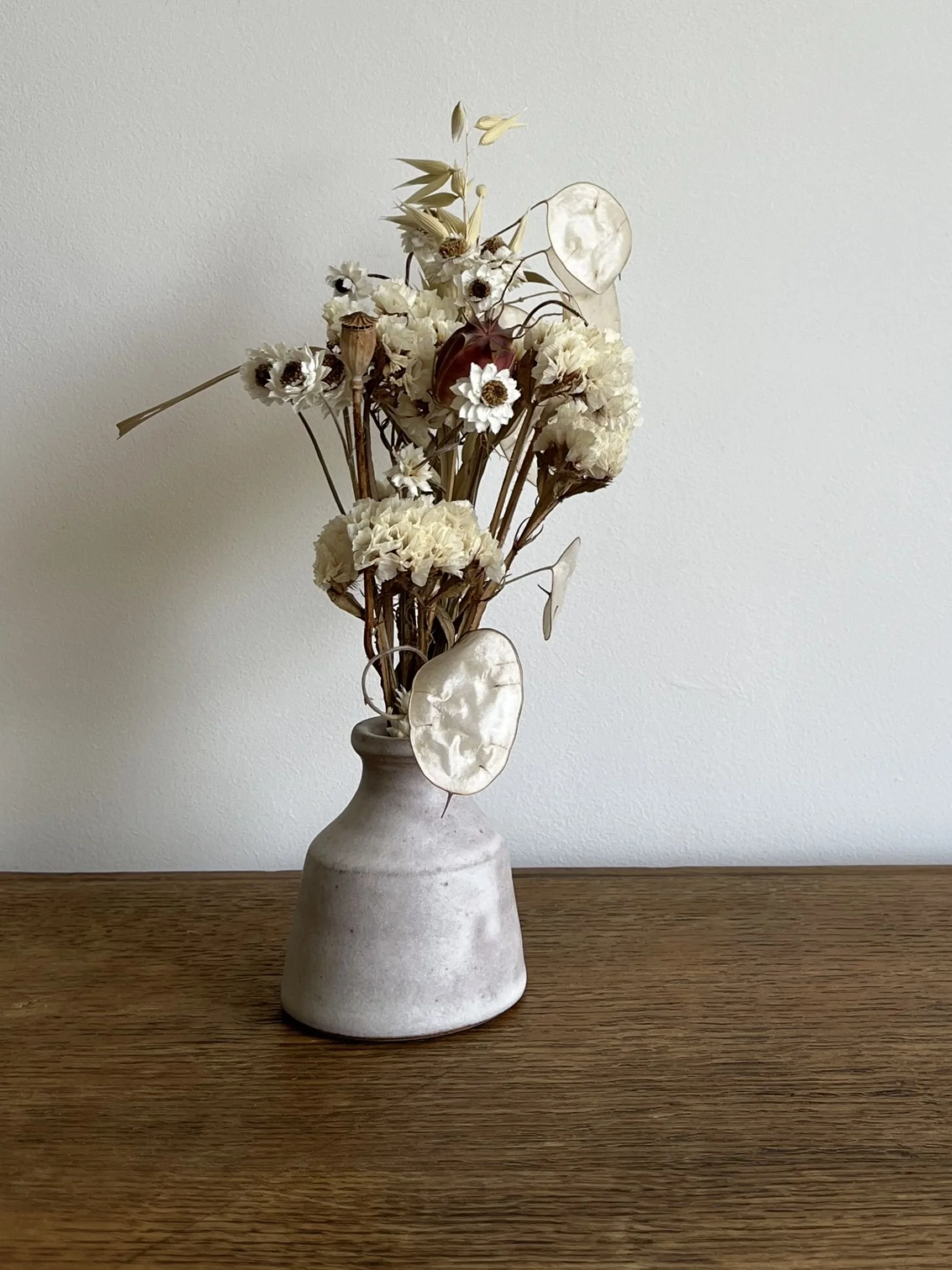 hand made stoneware bud vase with flowers