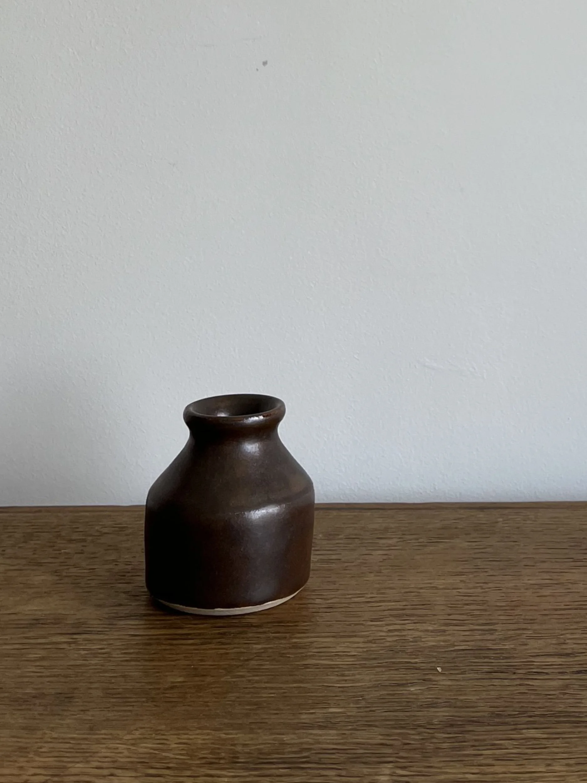 hand made stoneware bud vase in a deep brown