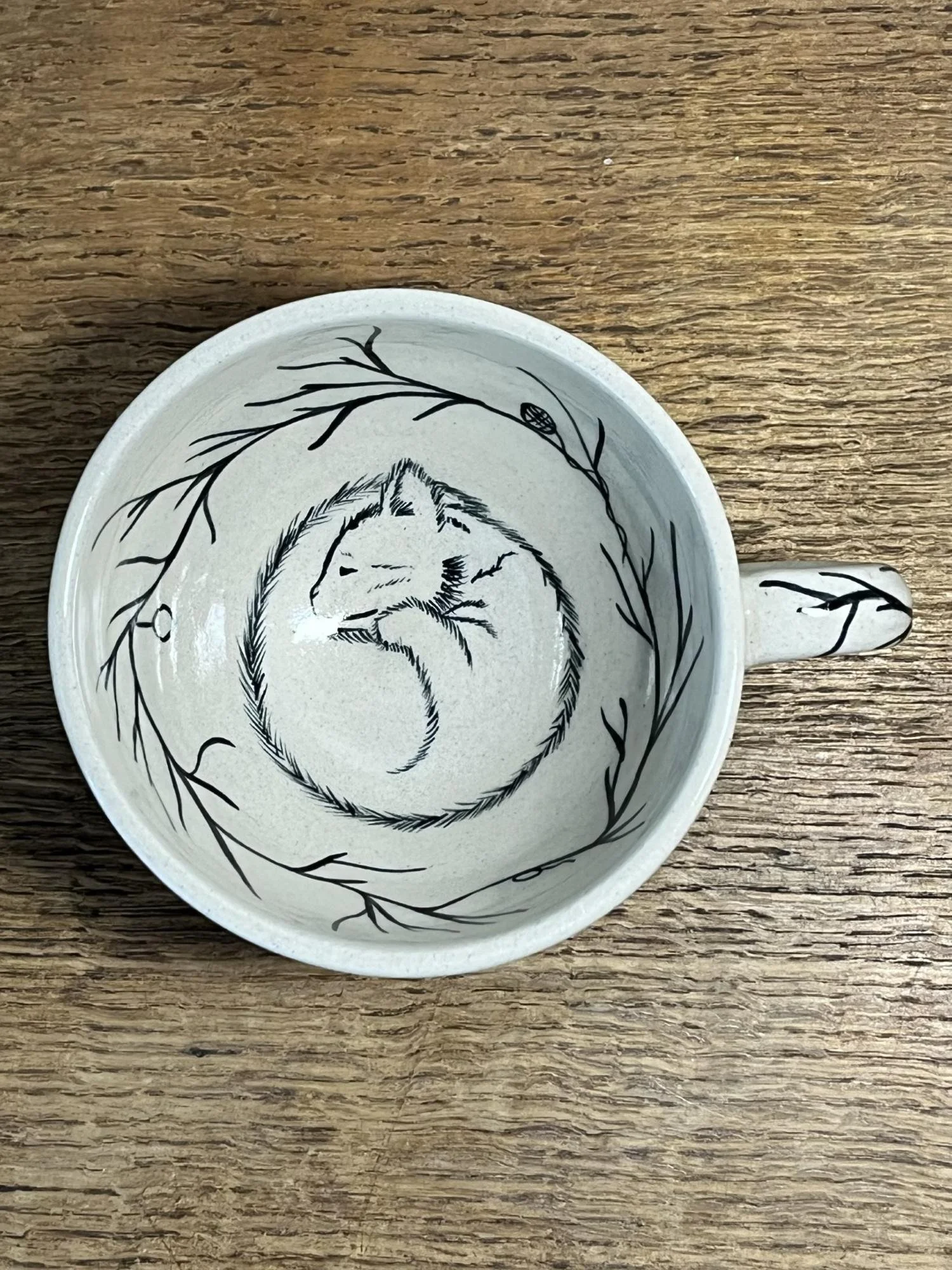 Handmade ceramic mug with cat detail