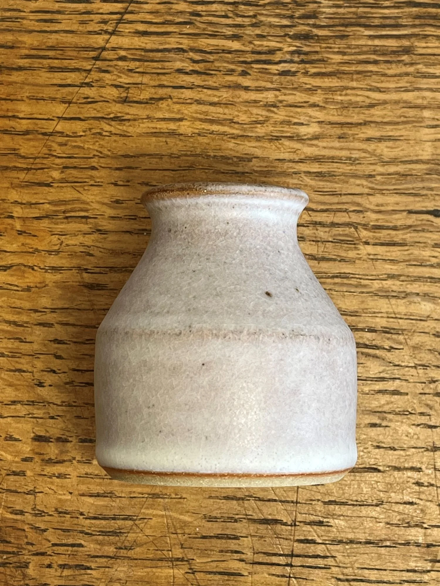 hand made stoneware bud vase in an off-white glaze