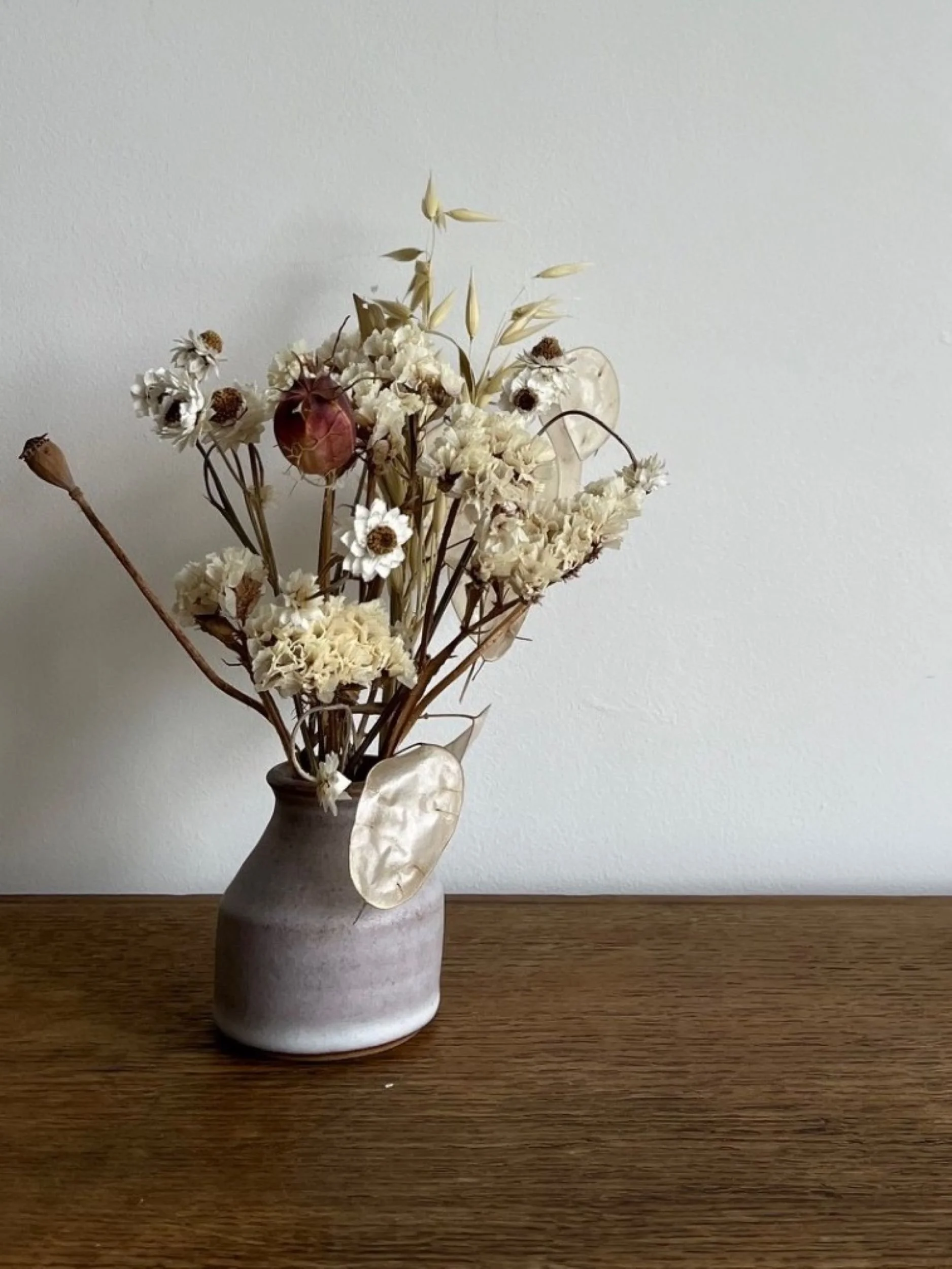 hand made stoneware bud vase with flowers