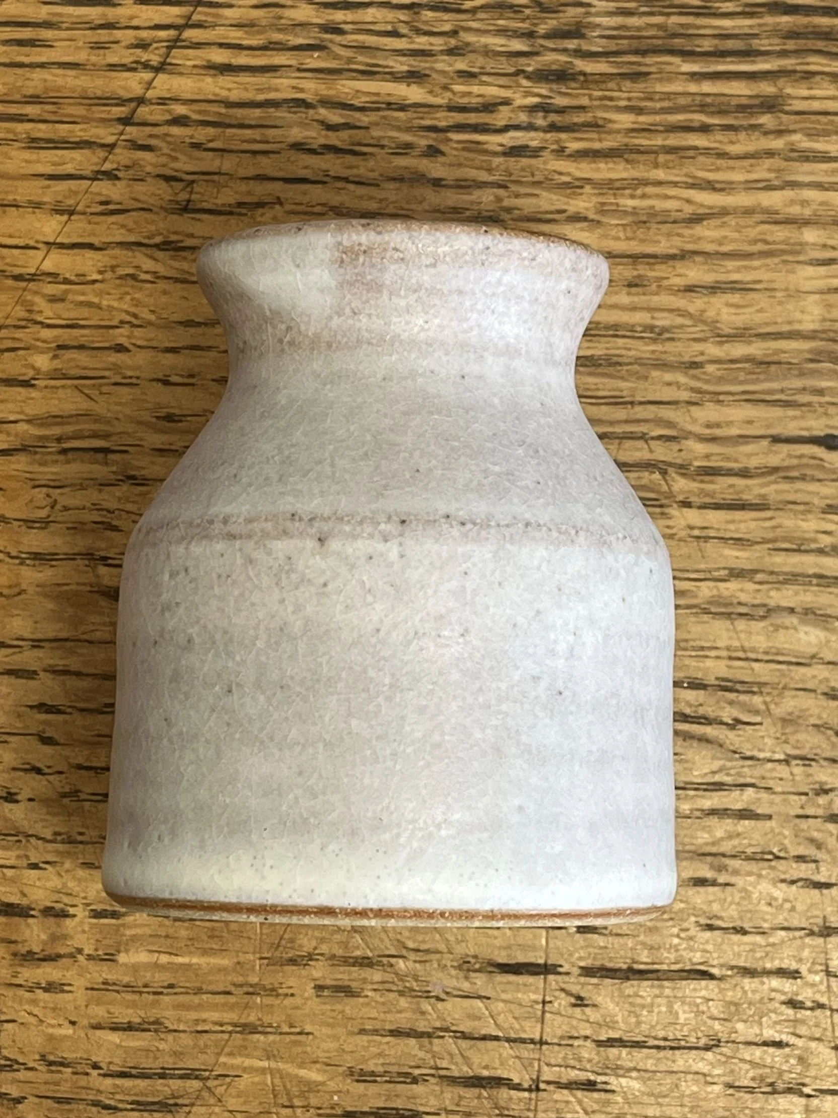 hand made stoneware bud vase in an off-white glaze