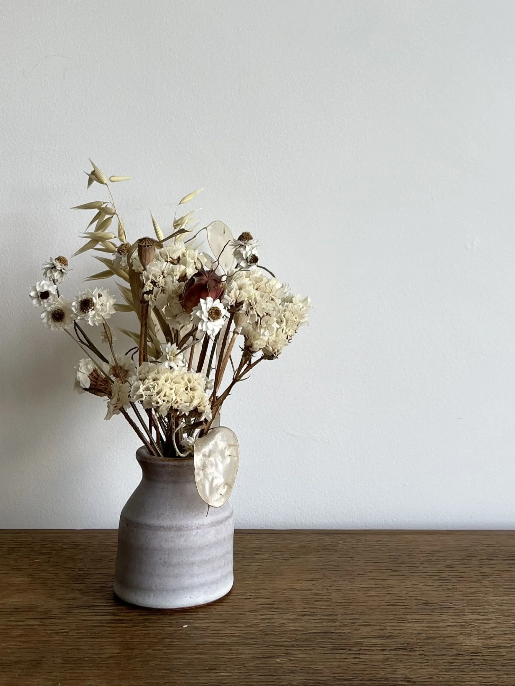 hand made stoneware bud vase with flowers